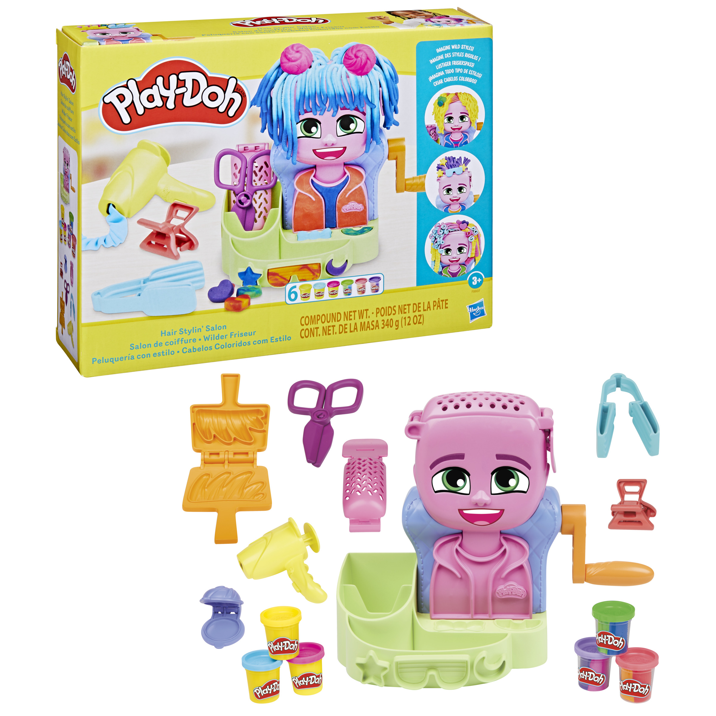 Set Play-Doh Hair Stylin' Salon. Incluye una muñeca, Play-Doh y herramientas de peinado. La caja es amarilla y verde.