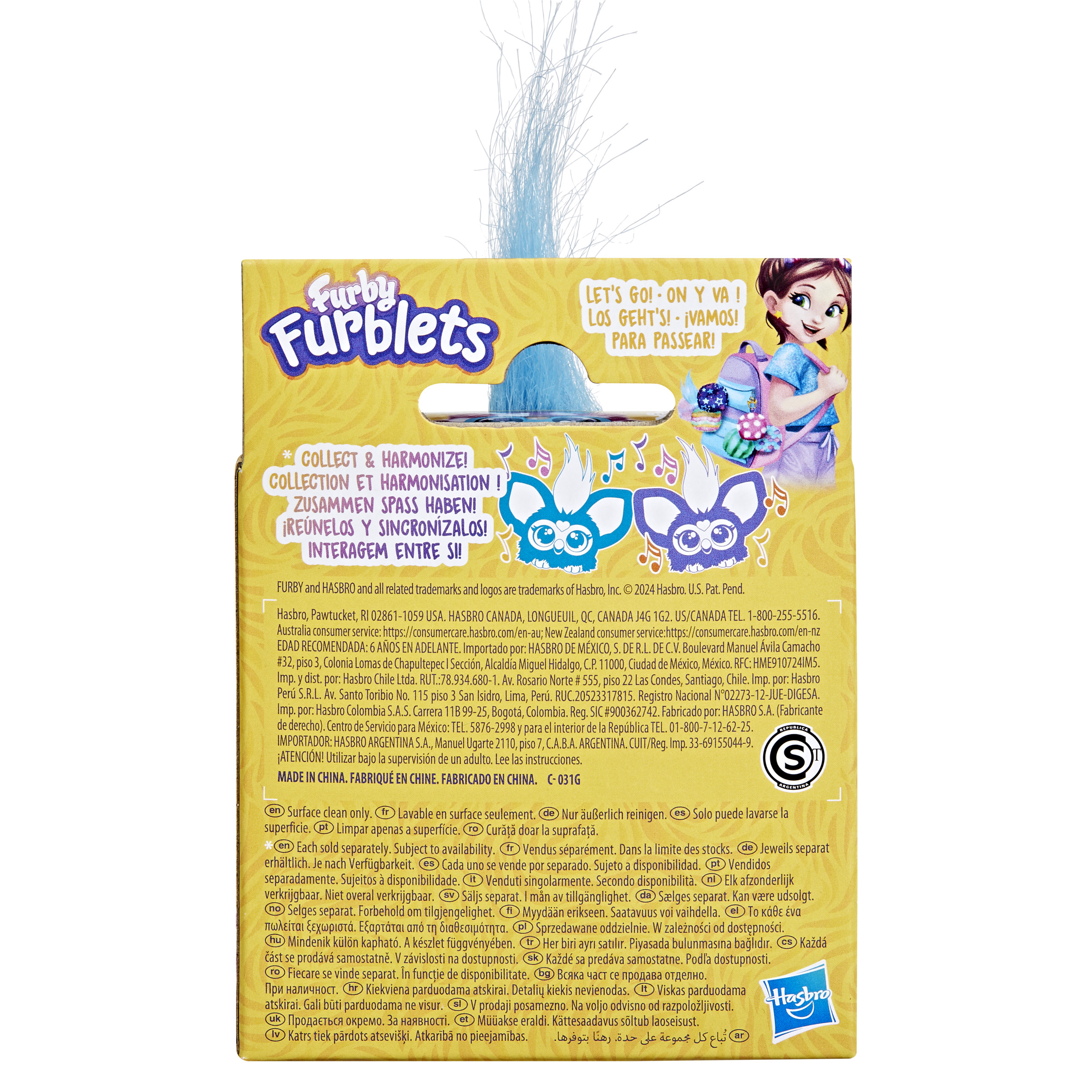 Un paquete de juguetes Furby con ilustración de niña y detalles del producto sobre fondo amarillo.