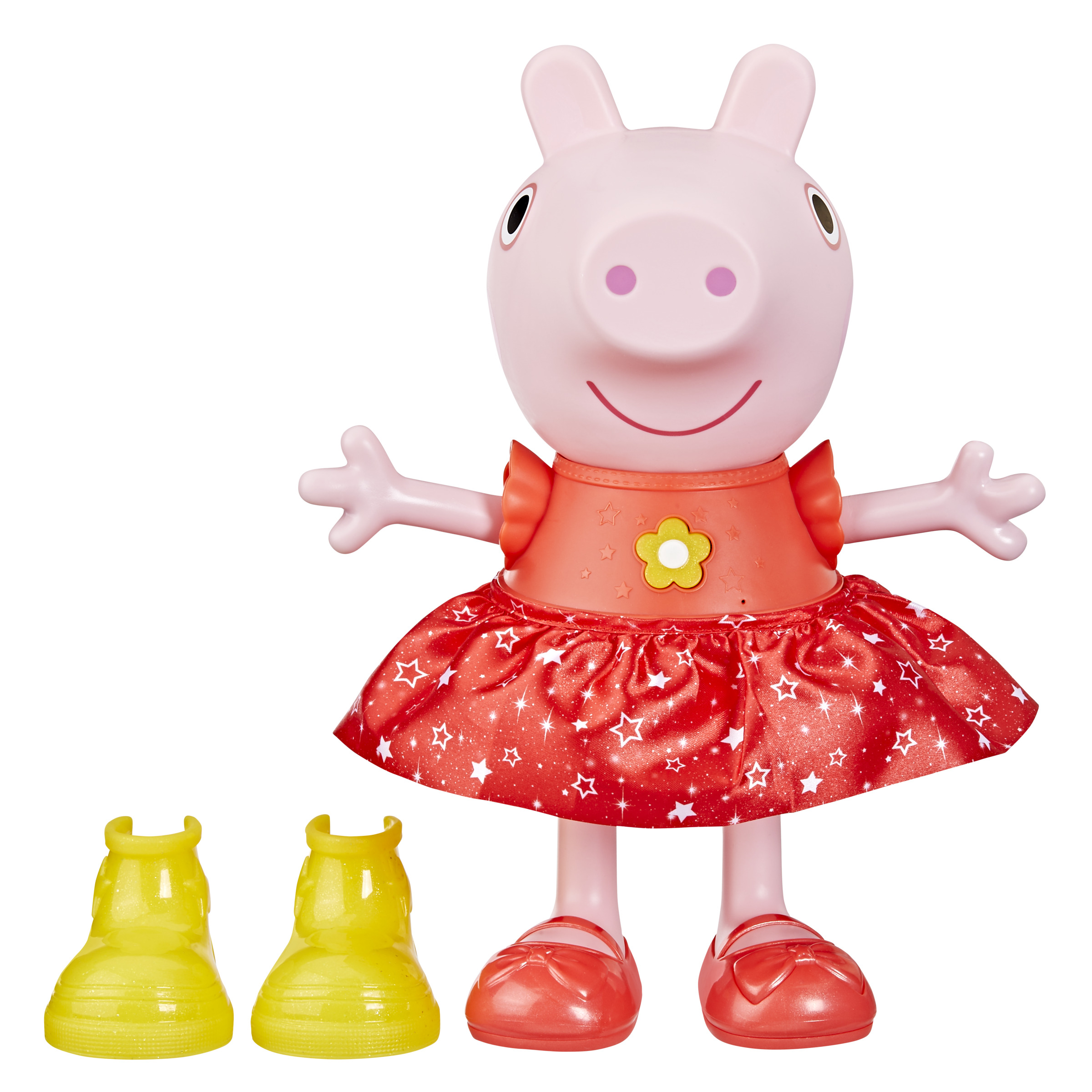 Juguete de cerdita rosa con vestido y zapatos rojos, dos botas amarillas. Fondo blanco.