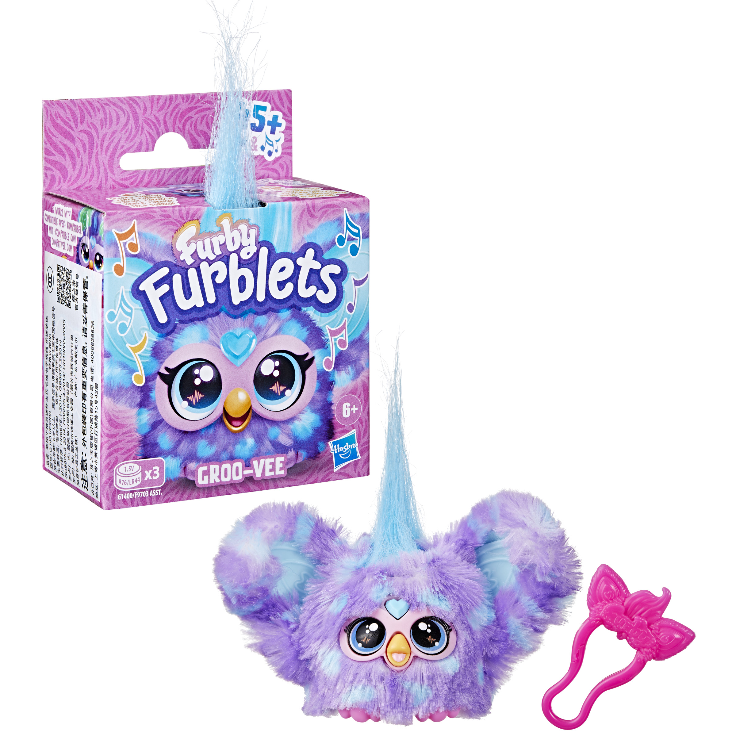 Una caja de juguetes Furblets con un juguete Groo-Vee y un accesorio rosa sobre un fondo blanco.