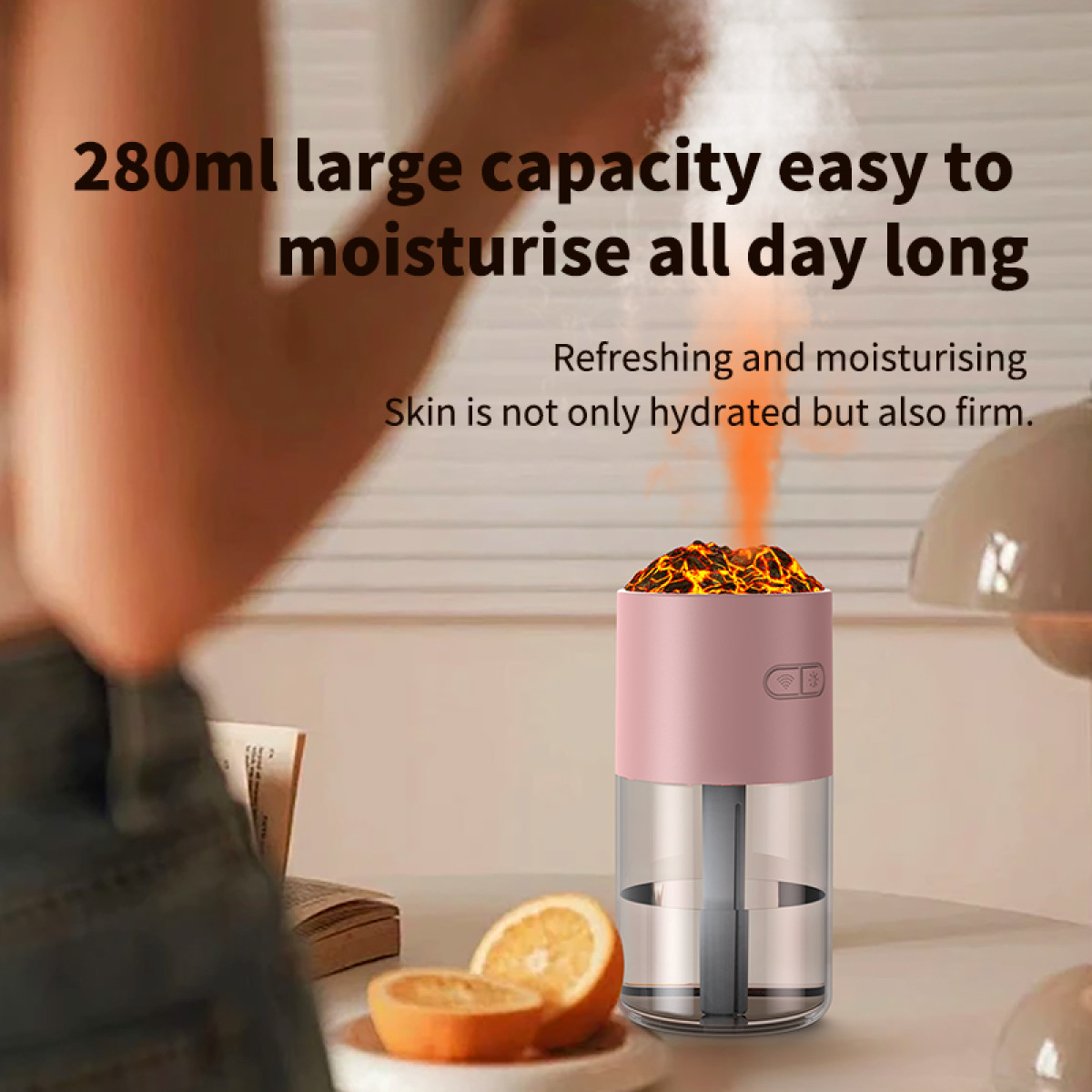 Ein rosa und klarer Luftbefeuchter auf einem Tisch. Daneben liegt eine Orange. Der Text lautet: 280ml, leicht zu befeuchten.