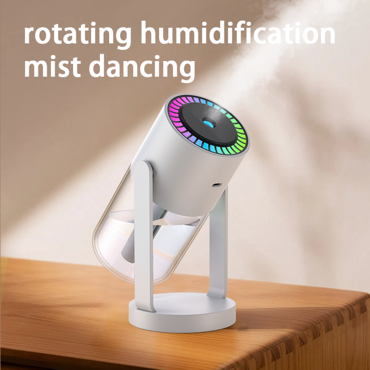 Ein weißer Luftbefeuchter mit bunten Lichtern auf Holz, Nebel im Hintergrund und Text 'rotierende Befeuchtung Nebeltanz'.