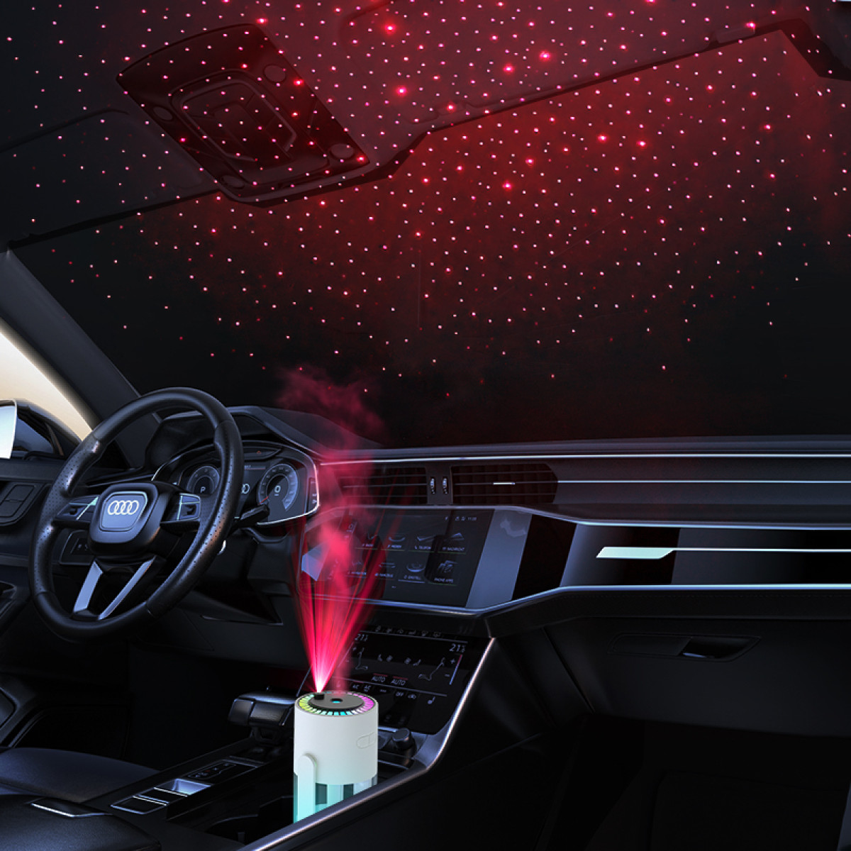 Autoinnenraum mit sternenartigen Deckenleuchten. Ein Luftbefeuchter emittiert rotes Licht. Lenkrad, Armaturenbrett und Sitze sind sichtbar.