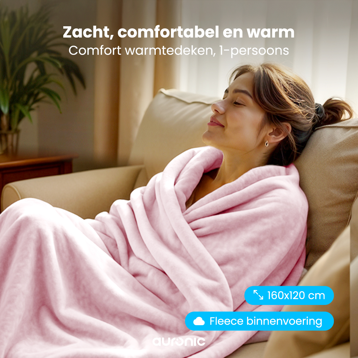 A woman wrapped in a pink blanket on a beige couch, eyes closed, product features mentioned.