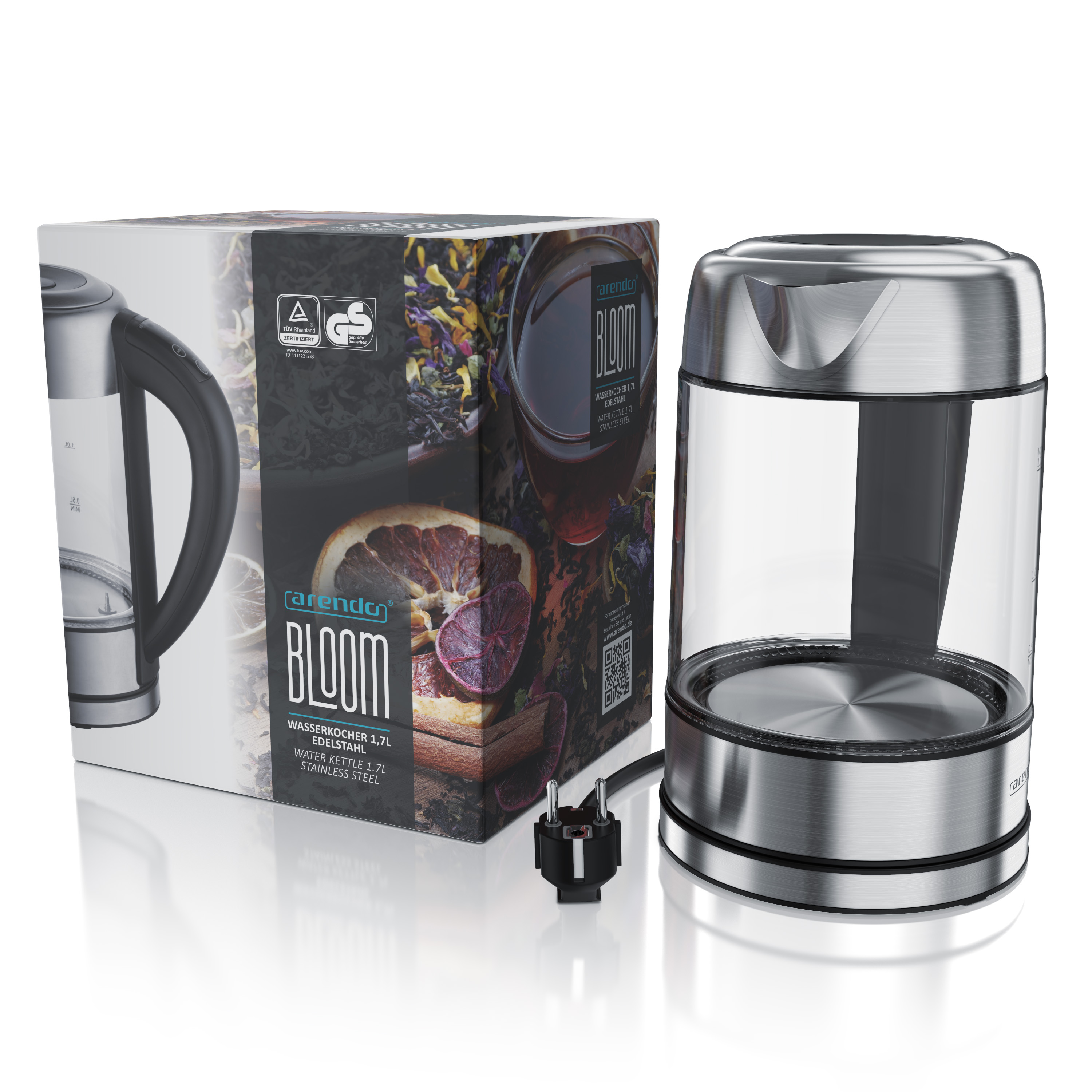 Ein klarer Glas-Elektrokessel und eine Schachtel mit einem Bild einer Teetasse und einer Orangenscheibe.