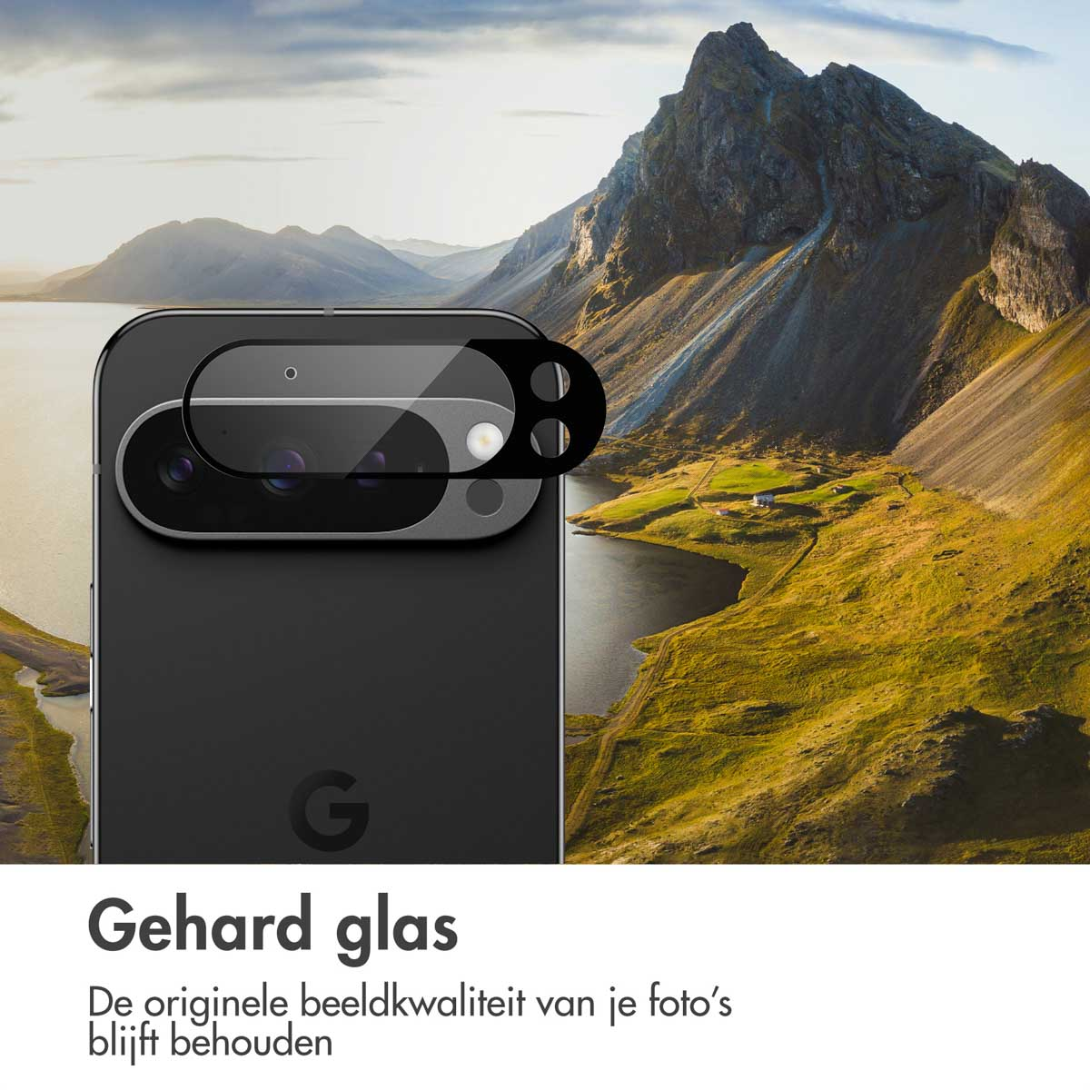 A phone with a screen protector overlayed on a scenic landscape with mountains, a lake, and green vegetation.
