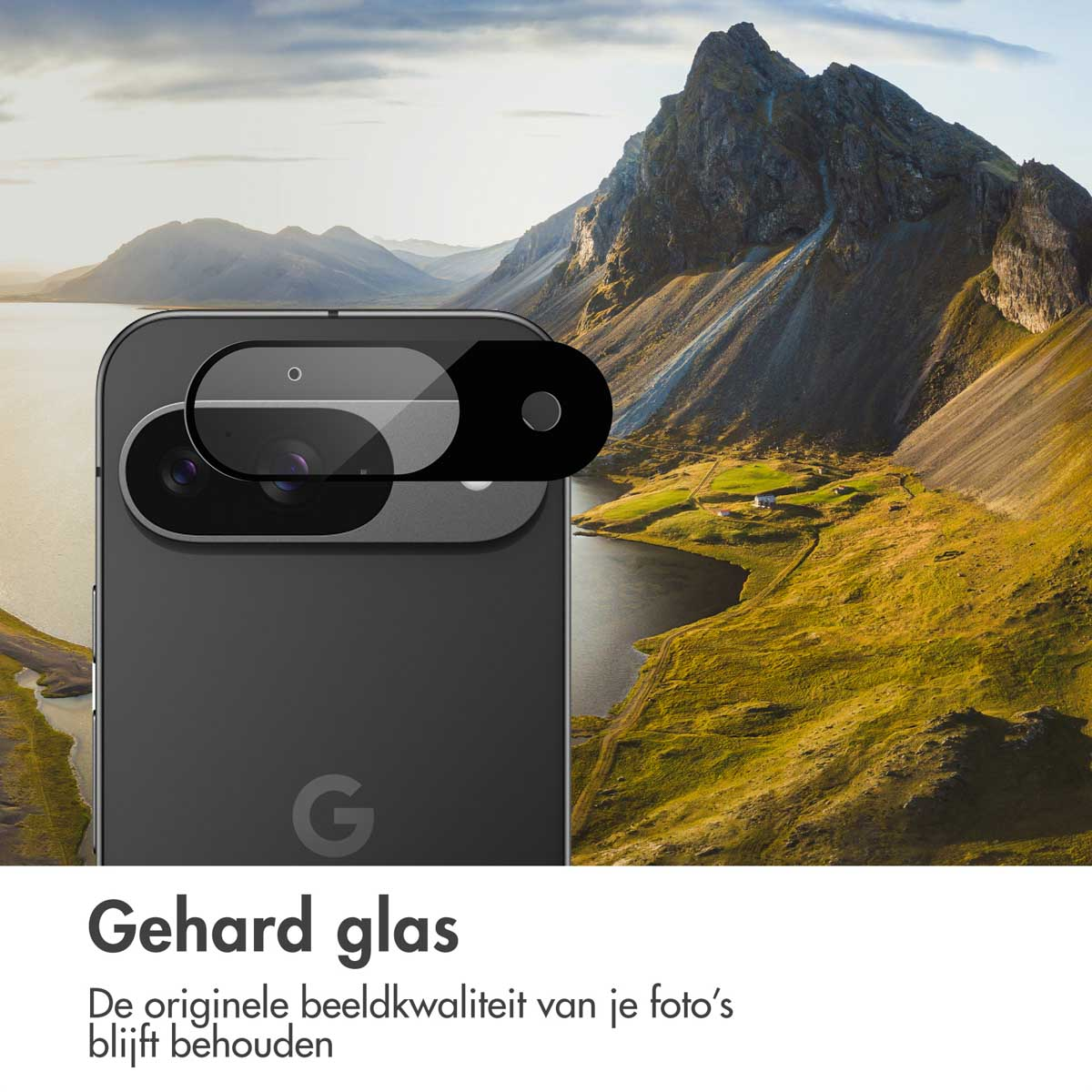 A phone with a protective lens cover. The background shows mountains, a lake, and green hills under a cloudy sky.