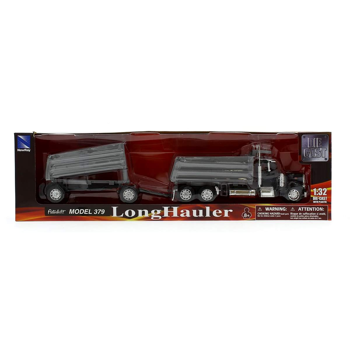 Un camión de juguete Peterbilt Long Hauler negro con remolque, exhibido en su caja. La caja tiene texto y advertencias.