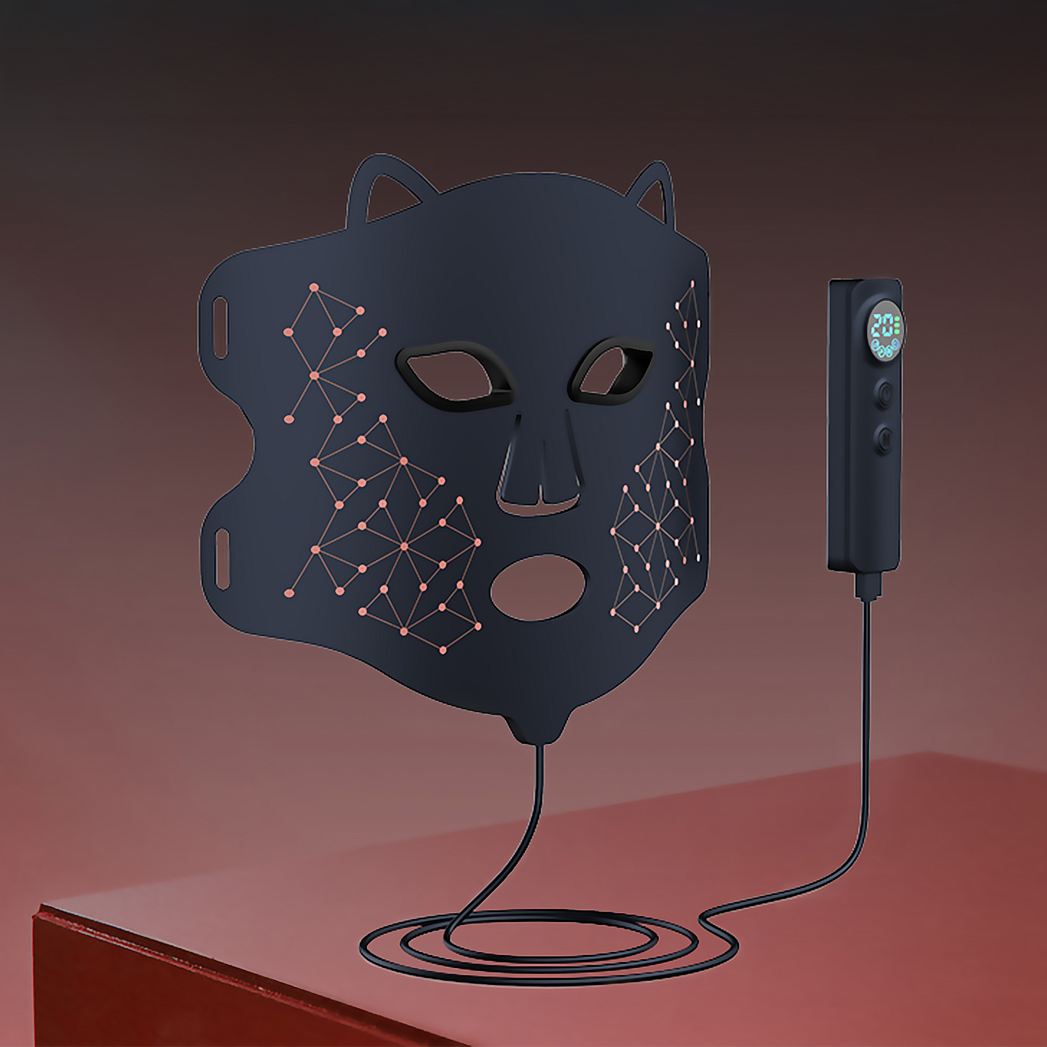 Eine dunkelblaue LED-Gesichtsmaske mit einem Bedienfeld befindet sich auf einer roten Oberfläche vor einem roten Hintergrund.