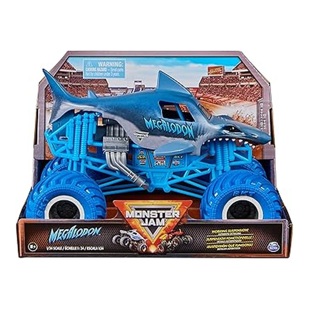 Niebieska zabawka ciężarówki potwora Megalodon w pudełku. Ciężarówka ma detale rekina, duże opony i logo Monster Jam.