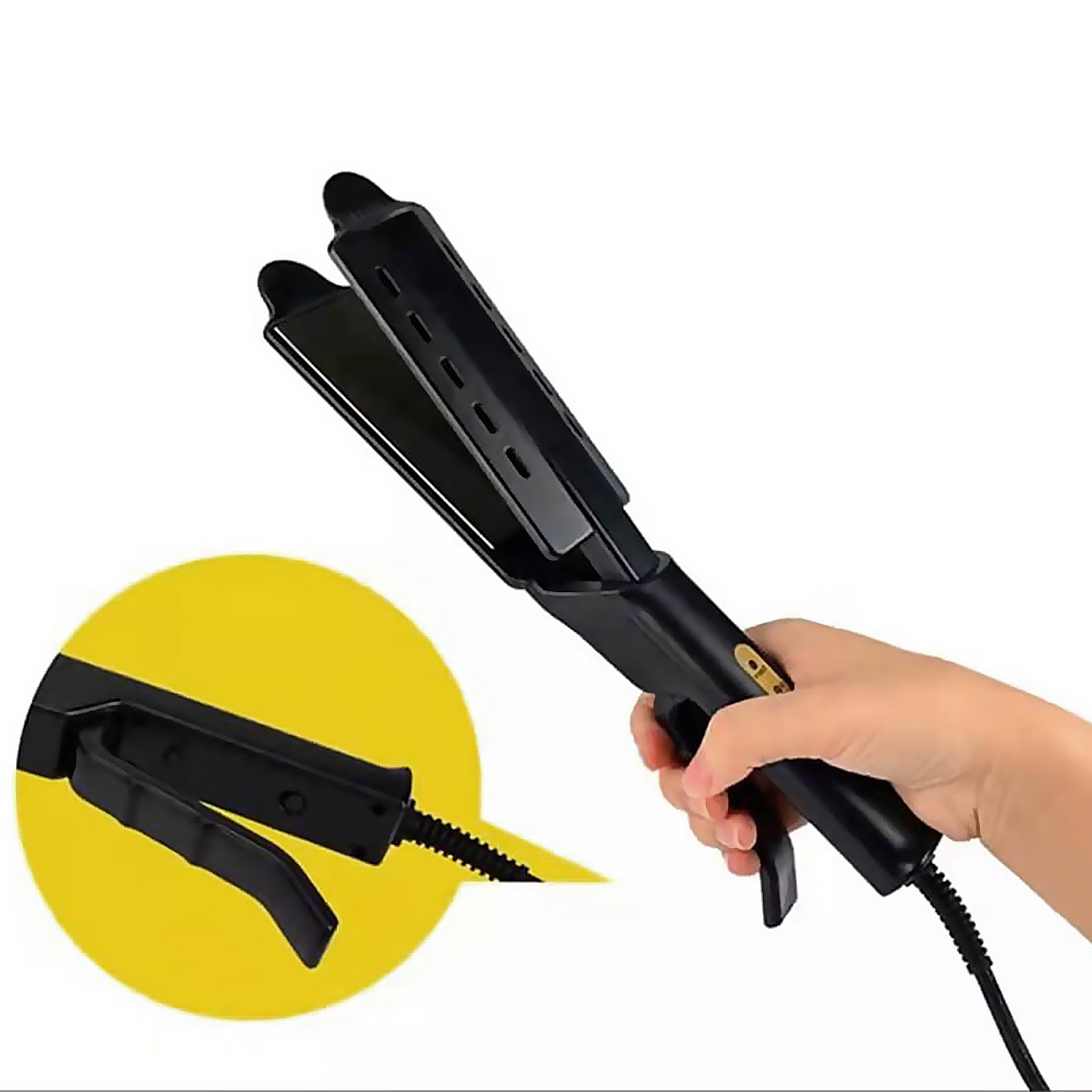 Una piastra per capelli nera tenuta in mano. Un cerchio giallo mostra un dettaglio della piastra.