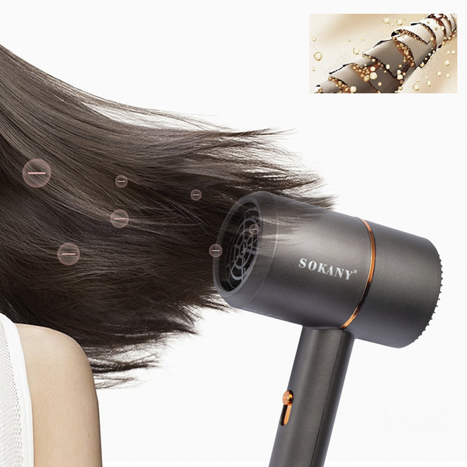 Una persona usa un asciugacapelli Sokany. Vengono asciugati capelli scuri. L'attenzione è sui capelli, con bolle e un'immagine dettagliata dei capelli.