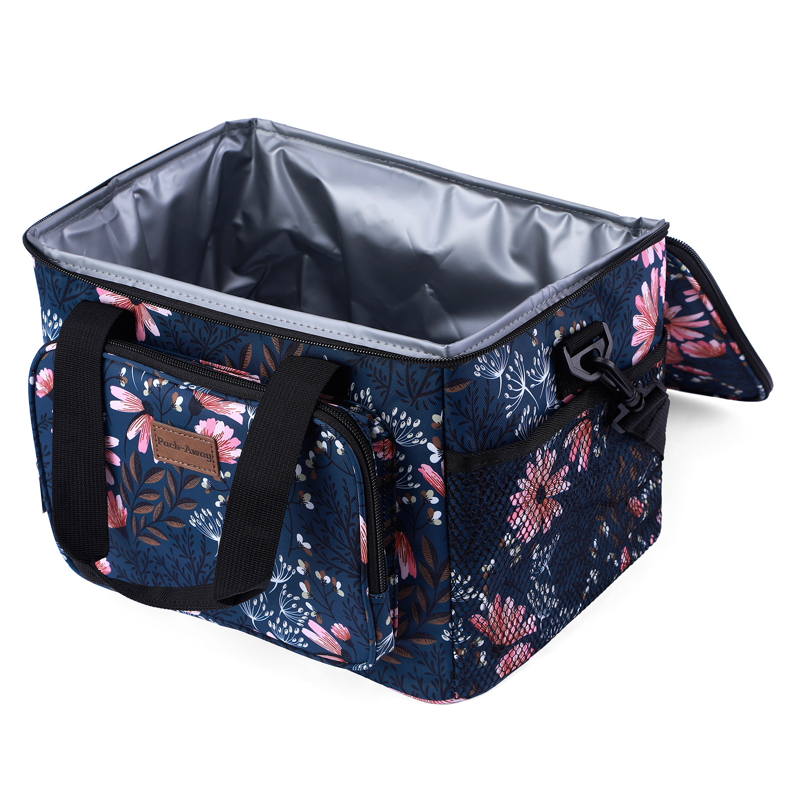 Open koeltas met bloemenprint op marineblauw. Zwarte handvatten, zijvakken en zilveren binnenkant. Witte achtergrond.