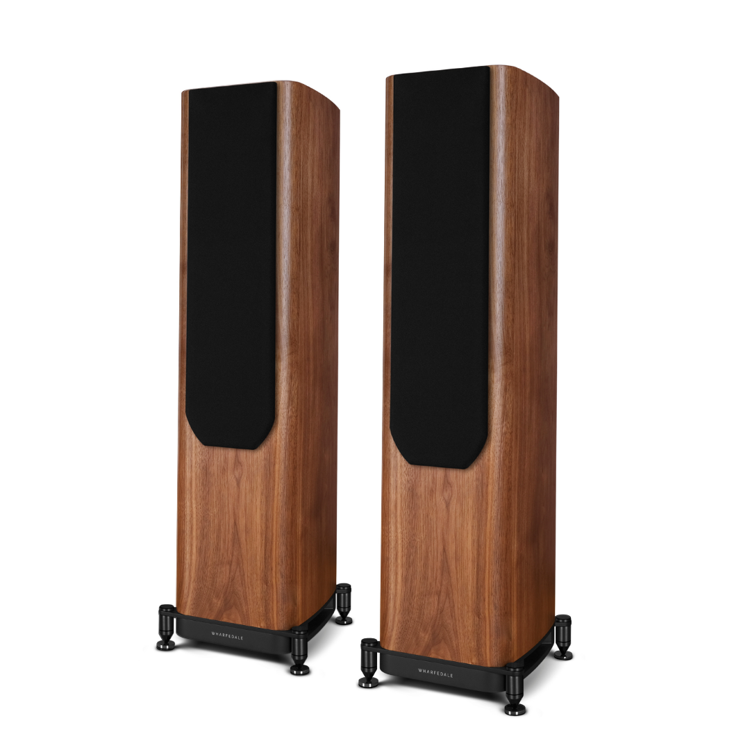 Two tall, wooden speakers with black panels and bases stand on a white background. Each has the brand name on the base.
