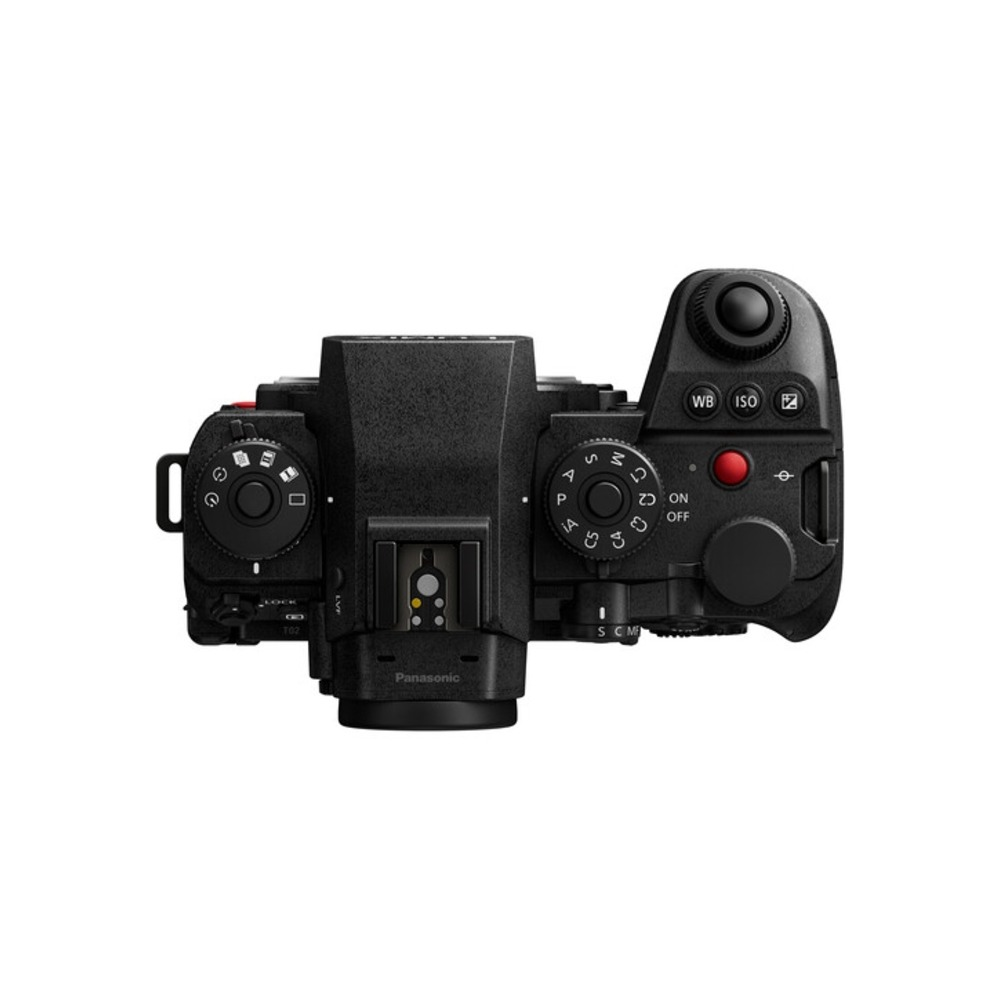Top view of a black Panasonic camera. Visible dials, buttons, and a hot shoe. White background.