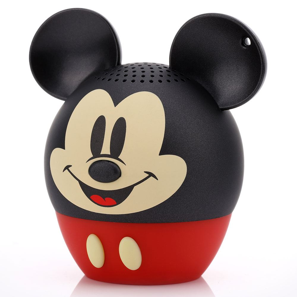 Un altoparlante a forma di Topolino. Testa nera con grandi orecchie, viso beige, bocca rossa e base rossa. Bottoni bianchi.