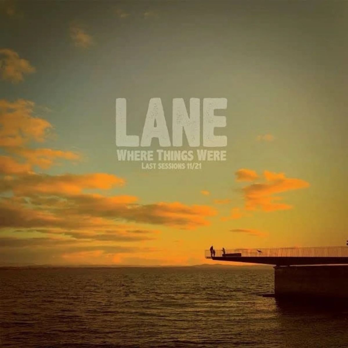 Tramonto sull'acqua con un molo. Il cielo è arancione e blu. Testo: 'LANE, Where Things Were, Last Sessions 11/21'.