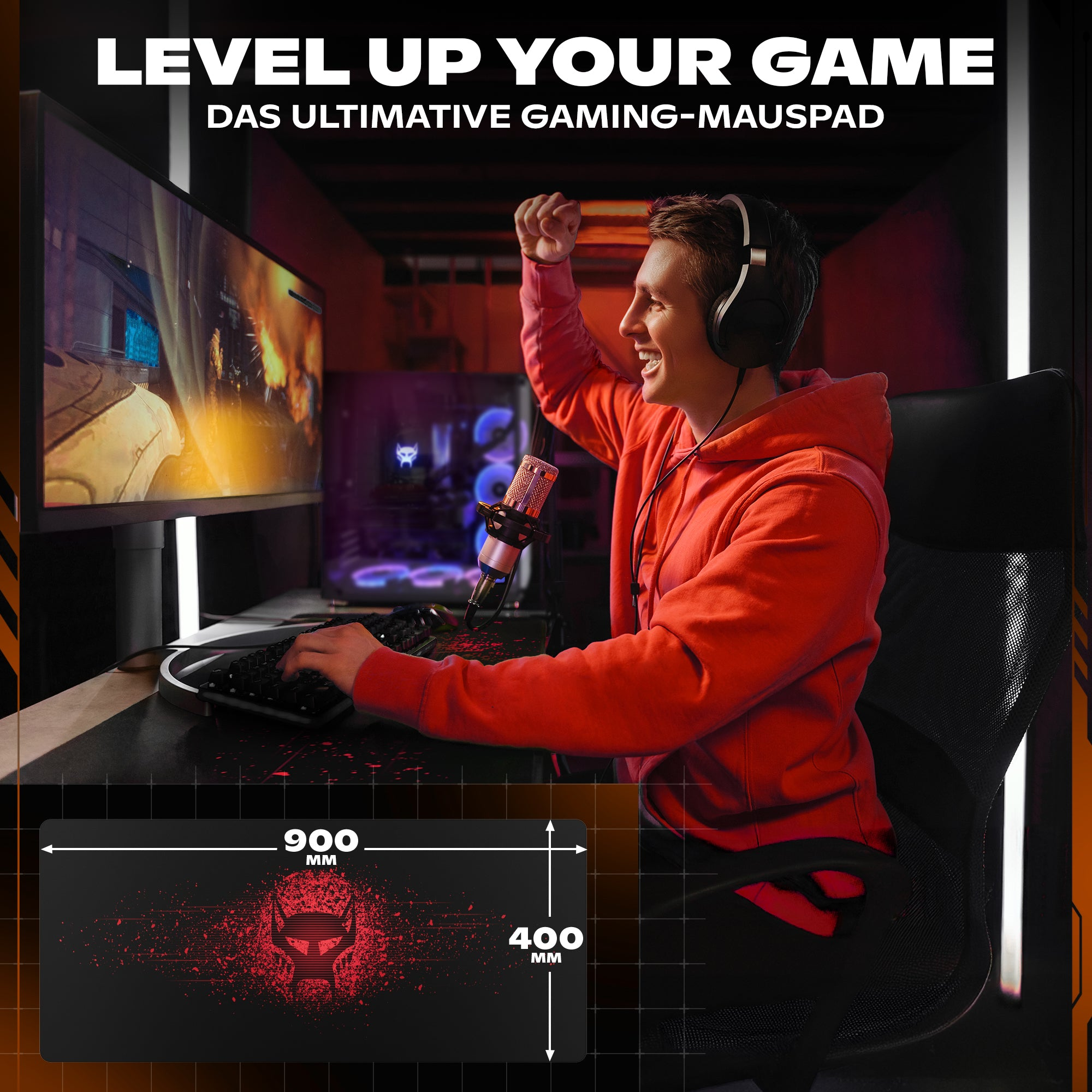 Gracz świętuje wygraną. Czerwona bluza, słuchawki, klawiatura, podkładka z czaszką, zestaw do gier.