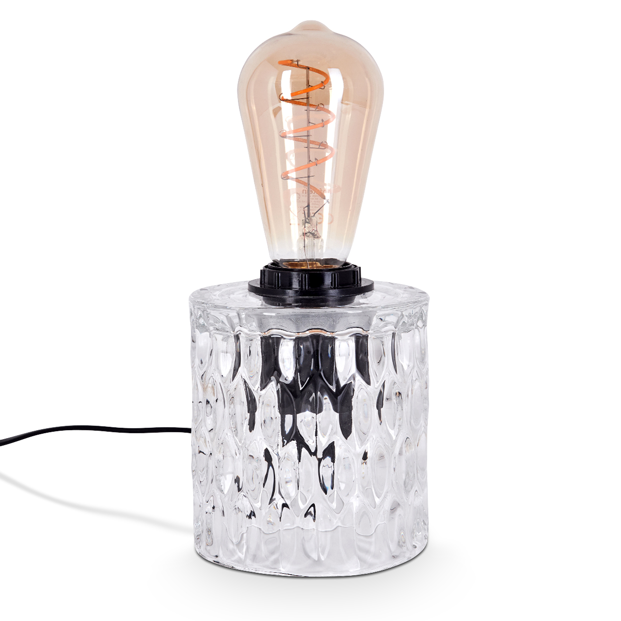 Eine dekorative Tischlampe mit einem Sockel aus klarem, strukturiertem Glas und einer großen, bernsteinfarbenen Glühbirne.