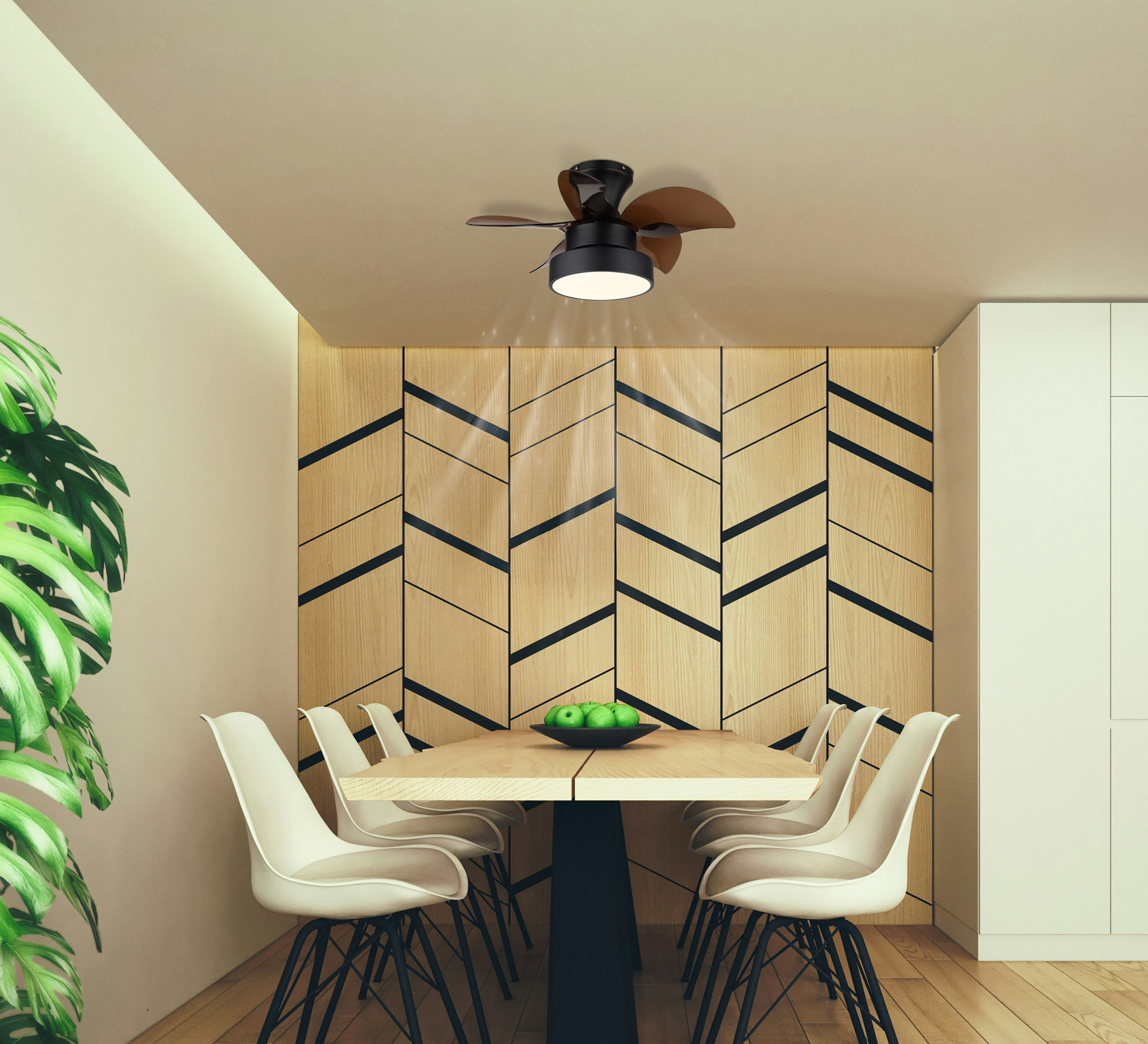 Esszimmer mit Tisch, Stühlen, Holzwand, Deckenventilator und Schale mit grünen Äpfeln.