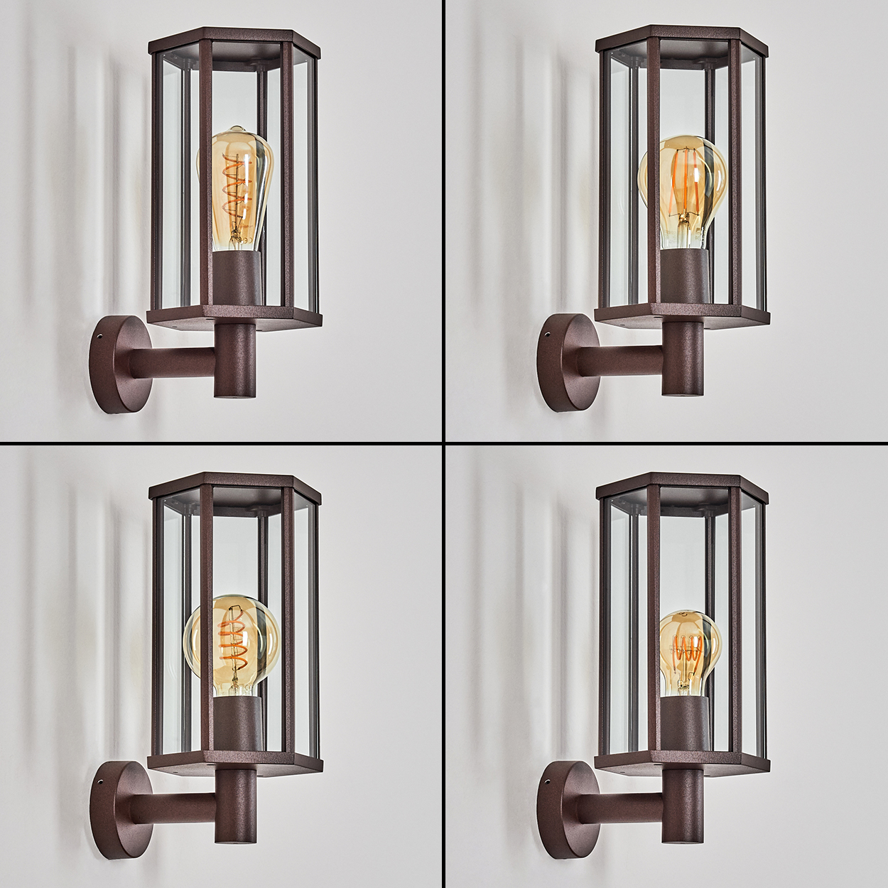 Vier braune Außenlampen. Jede hat eine Glühbirne in einem Glas- und Metallgehäuse, montiert an einer weißen Wand.