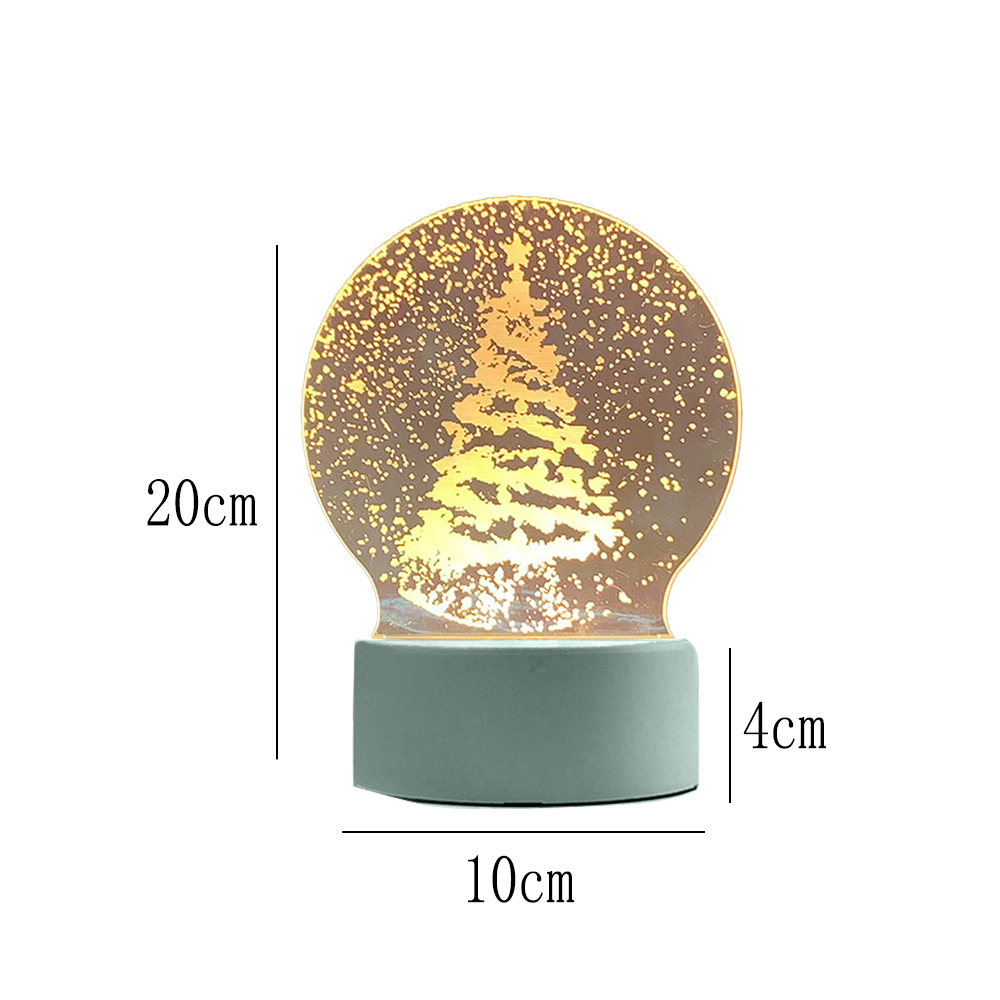 Eine dekorative Lampe mit einem Weihnachtsbaum-Design in einem Globus. Sie hat einen grauen Sockel. Maße: 20 cm Höhe, 10 cm Breite und 4 cm Tiefe.