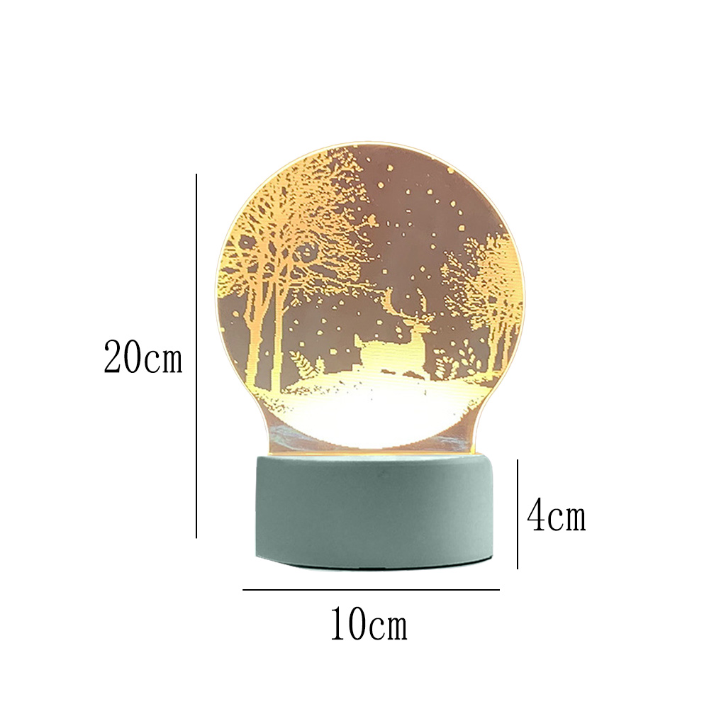 Eine dekorative Lampe mit Hirschszene. Sie hat einen grauen Sockel und einen runden, beleuchteten Oberteil mit einem Waldmotiv.