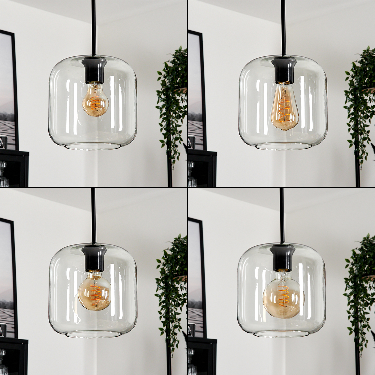 Vier Pendelleuchten mit klaren Glasschirmen und Edison-Glühbirnen. Jede ist von der Decke abgehängt. Pflanzen und Kunst im Hintergrund.