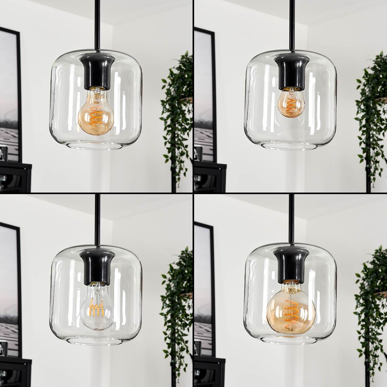 Eine moderne Pendelleuchte mit klarem Glasschirm und sichtbarer Edison-Glühbirne. Grüne Pflanzen und ein gerahmtes Bild im Hintergrund.