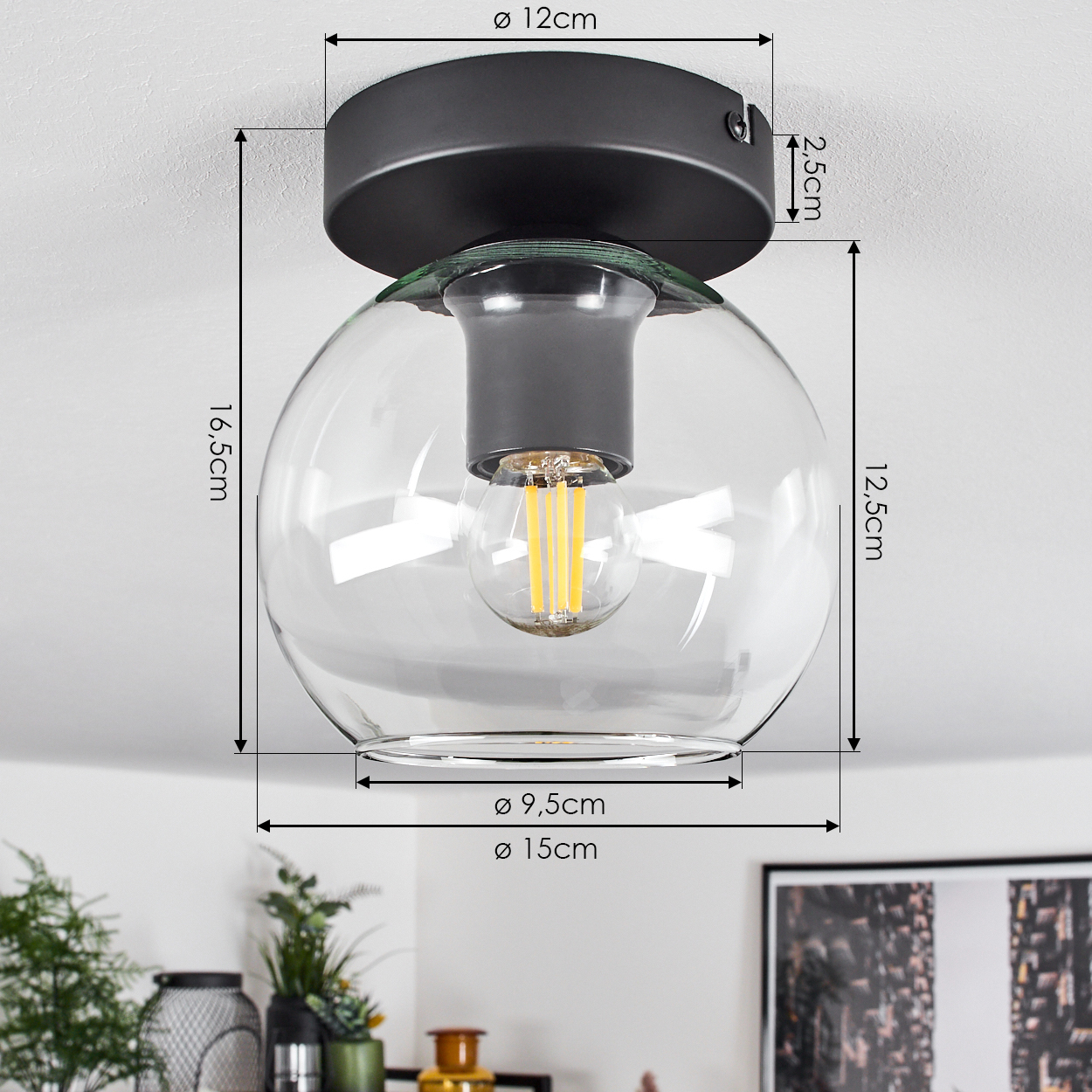 Moderne Deckenlampe mit klarem Glaskugel. Der schwarze Sockel befindet sich an der Decke. Abmessungen sind mit Pfeilen angegeben.