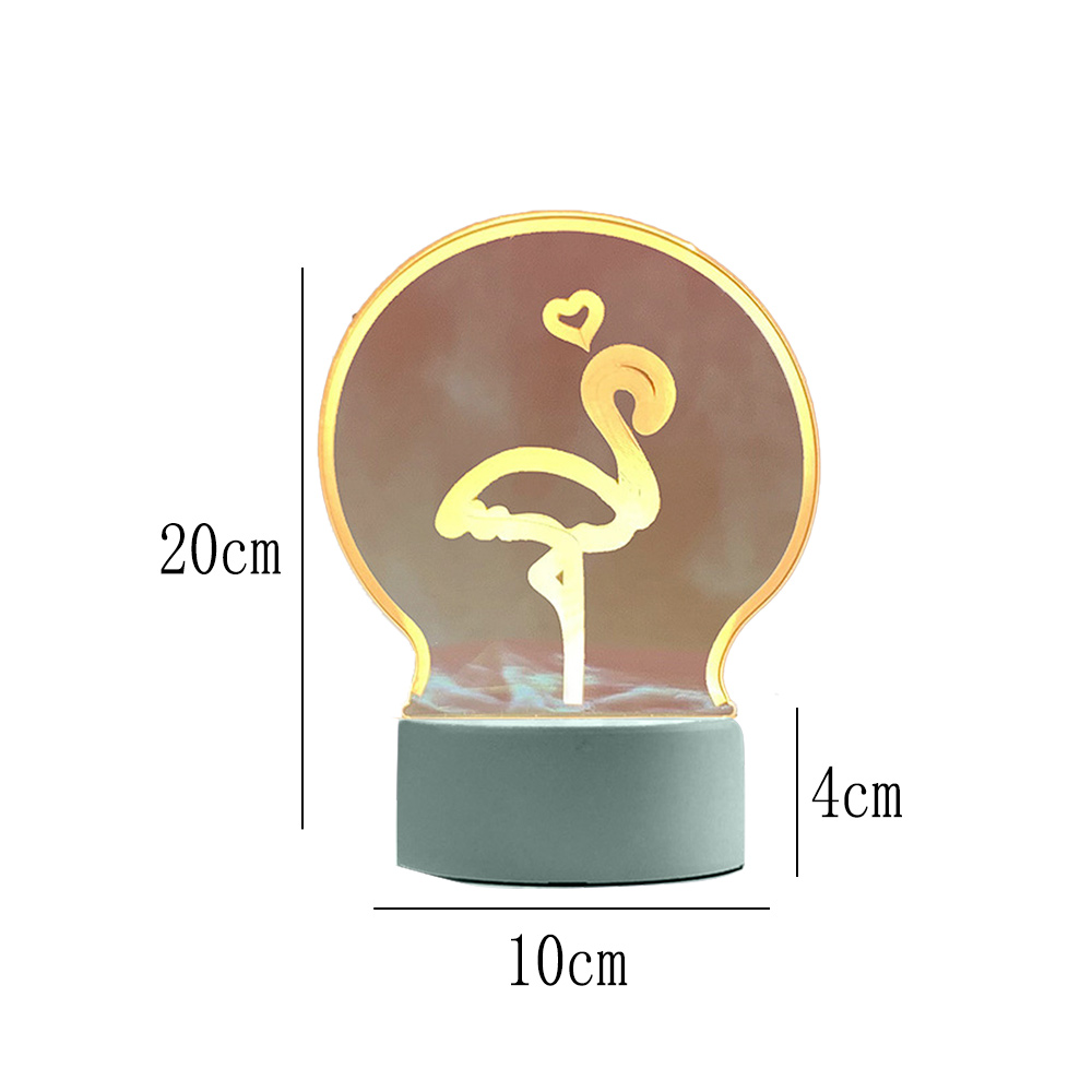 Flamingo-Lampe mit Herz, in Glühbirnenform. Grauer Sockel, 20 cm hoch, 10 cm breit, 4 cm Sockelhöhe. Flamingo ist gelb.