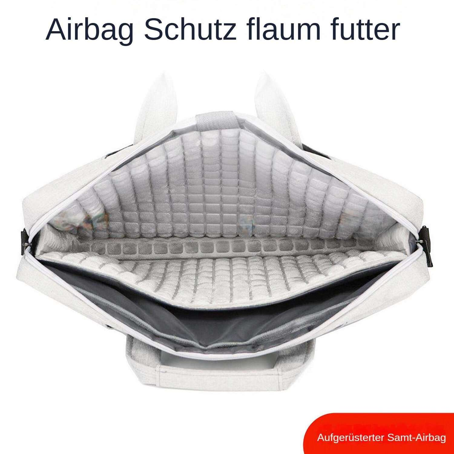 Offene graue Laptoptasche mit weißem Futter. Oben steht 'Airbag Schutz fläum futter'. Unten: 'Aufgerüsteter Samt-Airbag'.