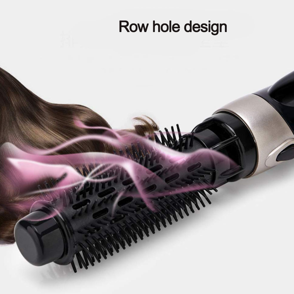 Haarstyling-Werkzeug mit schwarzen Borsten, Haaren und rosa Dampf. Der Text 'Row hole design' ist sichtbar.