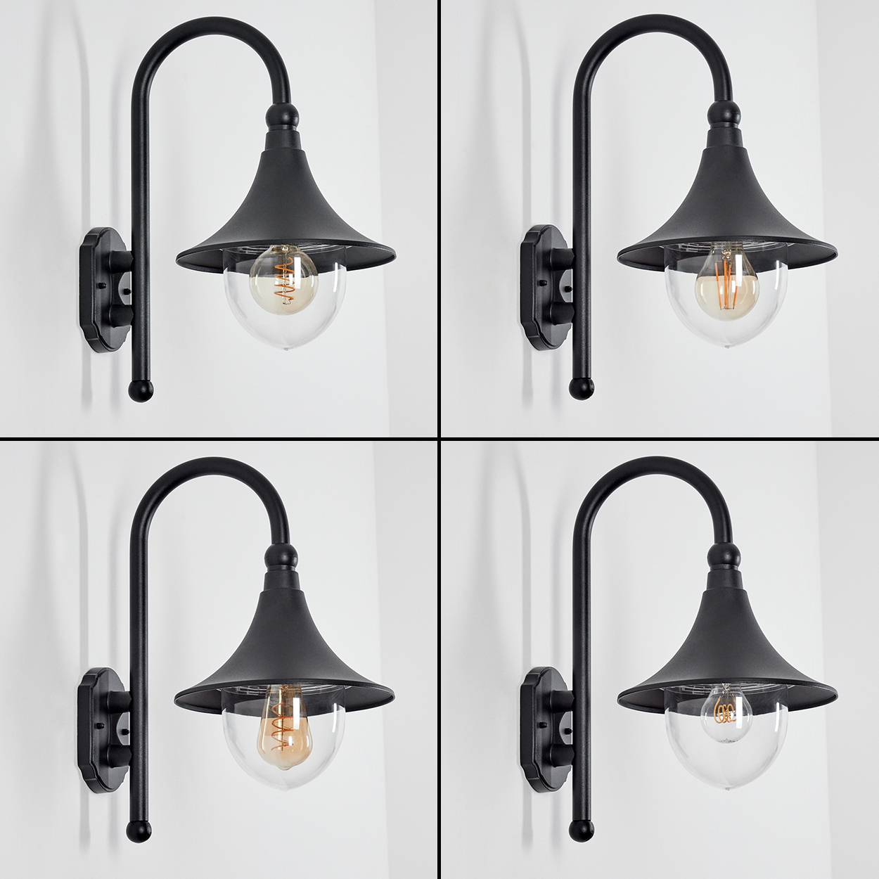 Vier schwarze Außenlampen an einer weißen Wand. Jede Lampe hat einen gebogenen Arm, einen konischen Schirm und ein klares, bauchiges Glas.