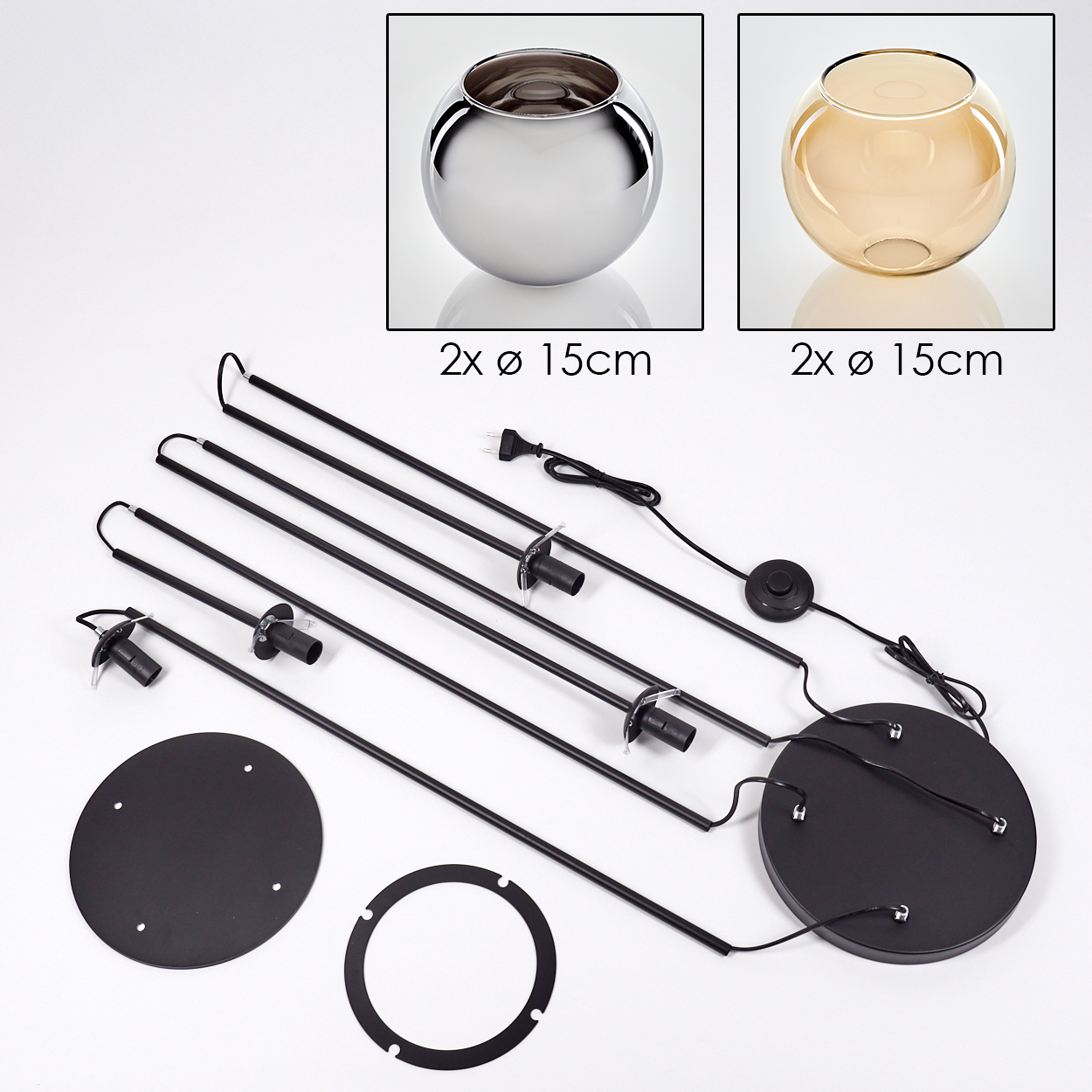 Das Bild zeigt eine zerlegte Lampe. Zwei Glasschalen, schwarze Metallteile und ein Sockel sind sichtbar. Kabel und ein Schalter sind ebenfalls vorhanden.