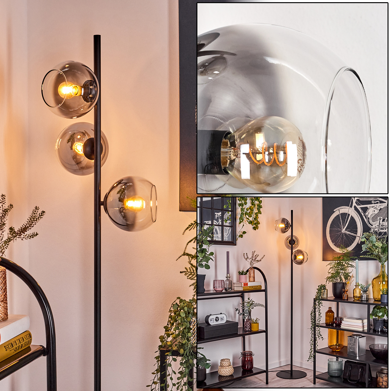 Eine moderne Stehlampe mit drei kugelförmigen Schirmen. Die Lampe ist schwarz, die Schirme sind aus Rauchglas. Im Hintergrund sind Regale und Pflanzen zu sehen.