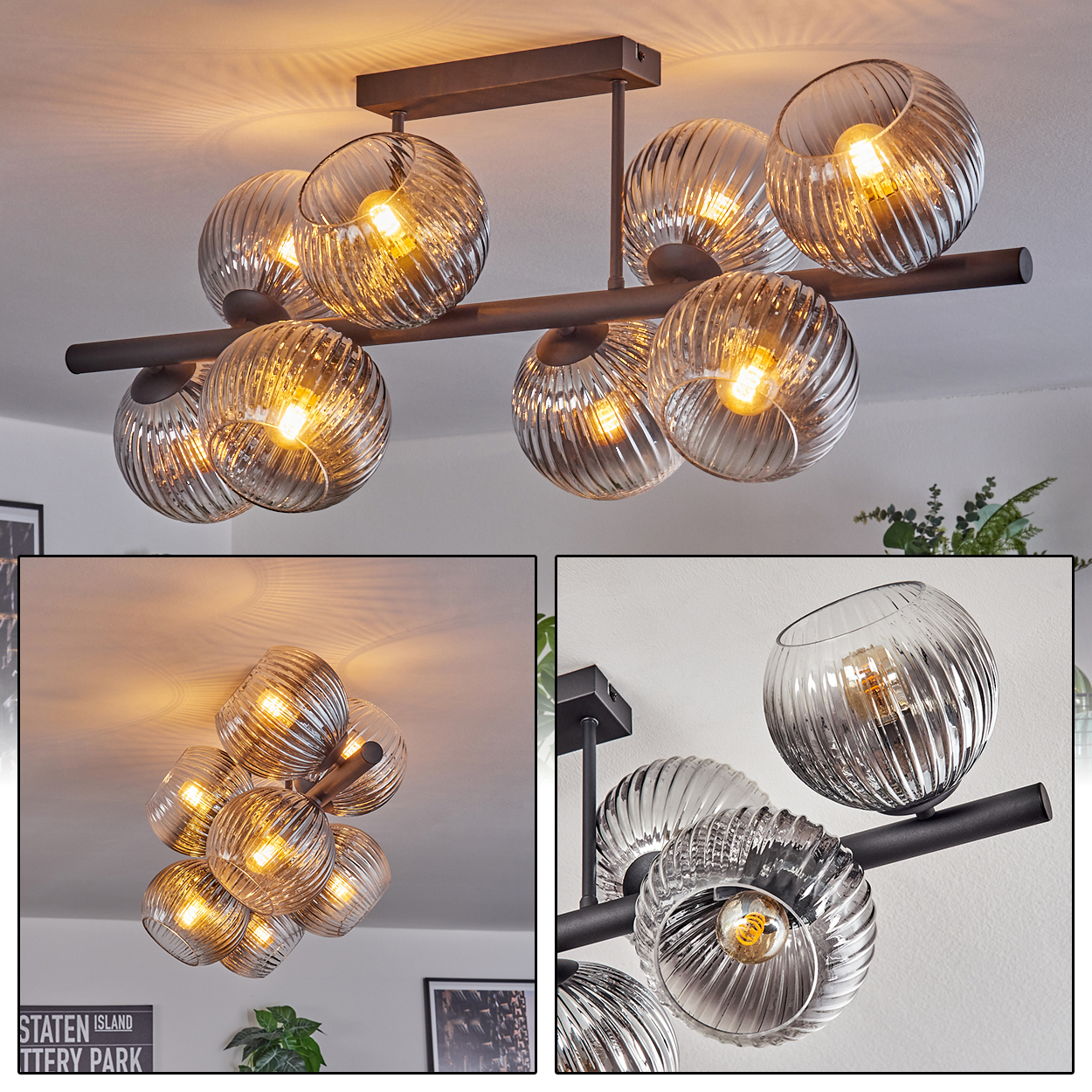 Moderne Deckenleuchte mit mehreren Glaskugelschirmen, jede mit sichtbarer Glühbirne. Die Leuchte ist aus dunklem Metall.