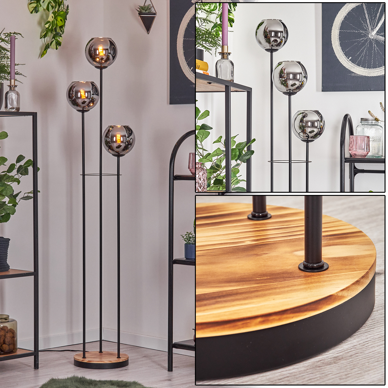 Stehlampe mit drei kugelförmigen Schirmen. Schwarzer Metallrahmen mit Holzsockel. Regale, Pflanzen und Dekorationsartikel im Hintergrund.