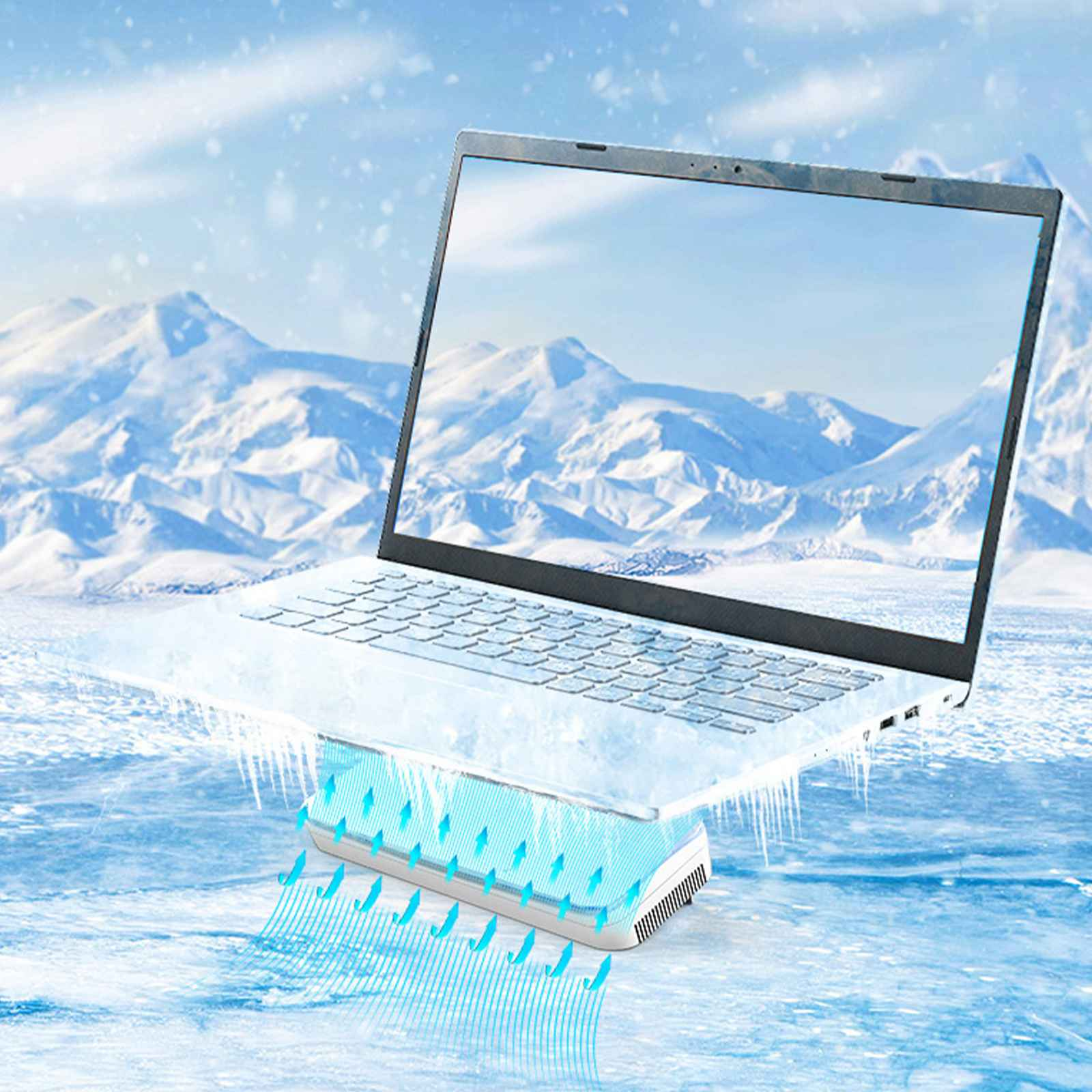 Laptop auf Kühlpad. Kalte Szene mit eisigen Bergen im Hintergrund. Blauer Luftstrom vom Pad.