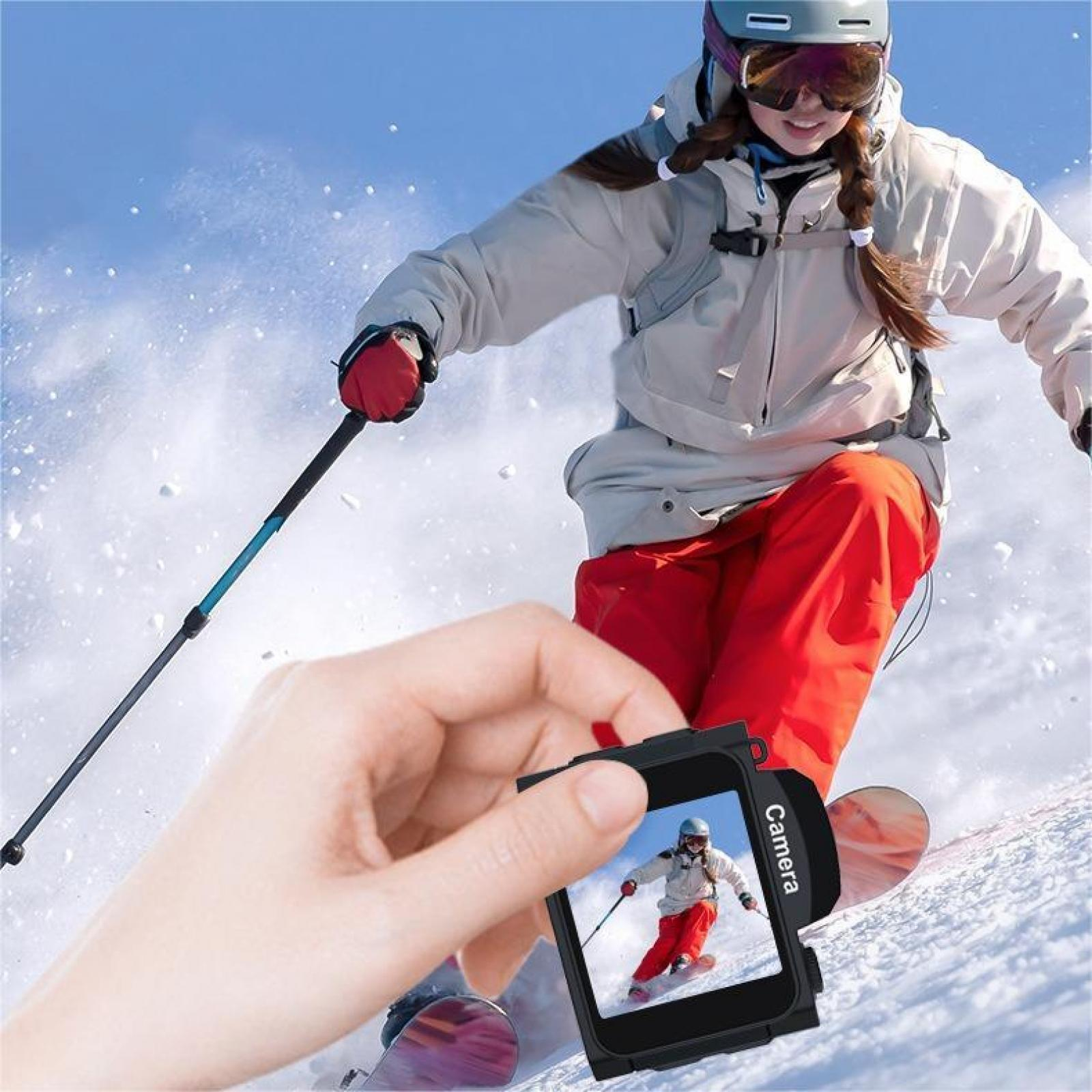 Eine Person, die Ski fährt, wird von einer Kamera erfasst, die von einer Hand gehalten wird. Der Bildschirm zeigt dieselbe Person beim Skifahren.