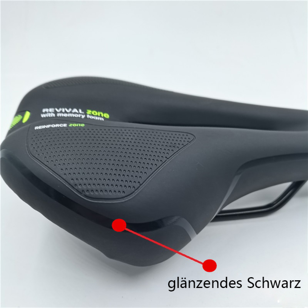 Ein schwarzer Fahrradsattel mit den Wörtern 'REVIVAL zone' und 'REINFORCE zone'. Er hat eine glänzend schwarze Oberfläche.