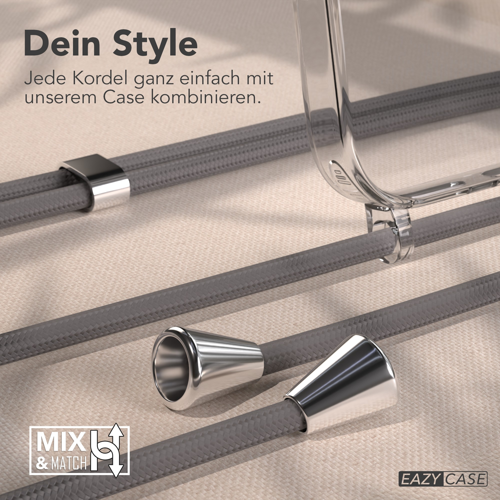 Graue Kordeln mit Metallakzenten und eine transparente Handyhülle. Text: 'Dein Style' und 'MIX & MATCH'.