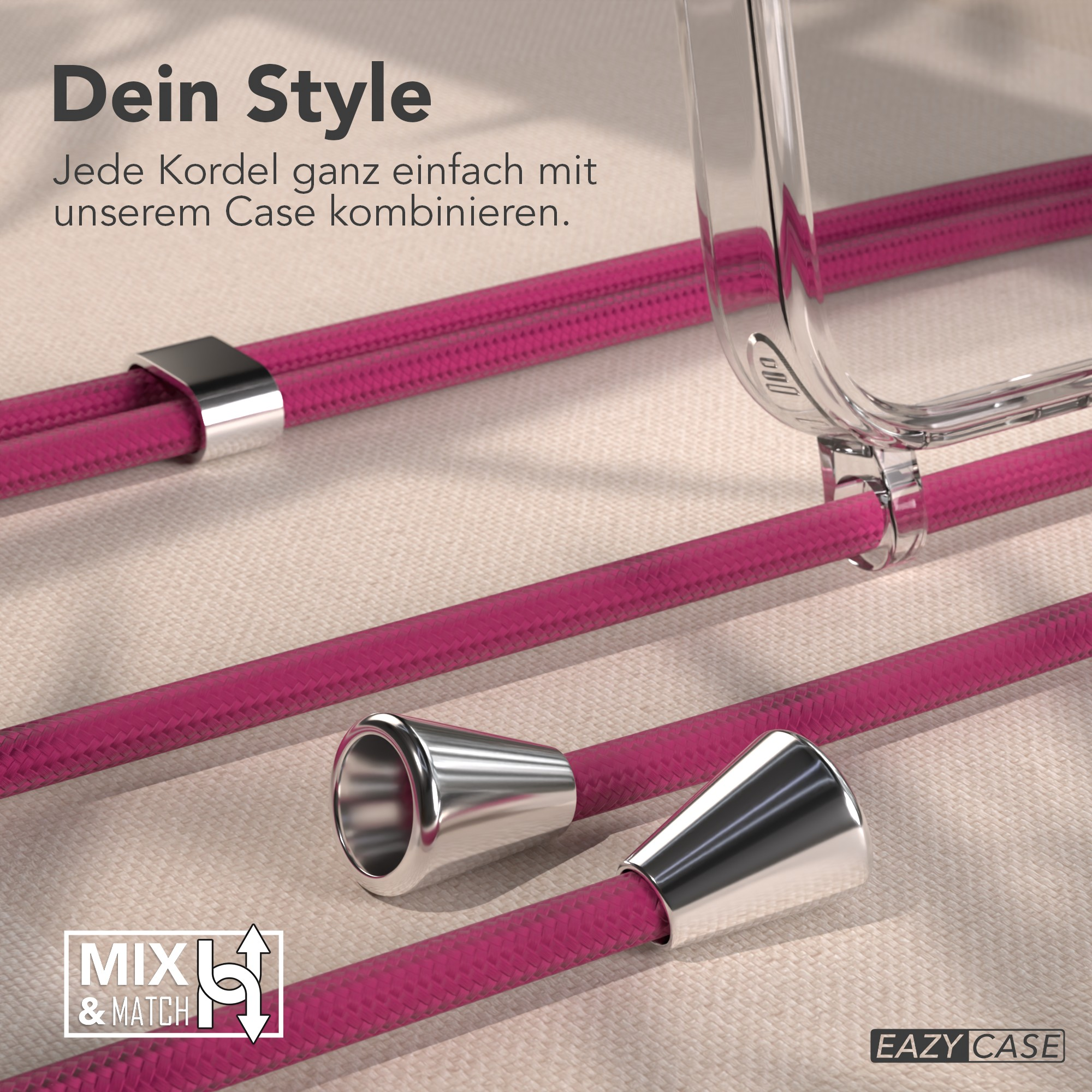 Pinke Kordeln mit silbernen Akzenten und eine transparente Handyhülle. Der Hintergrund ist ein neutraler Stoff.
