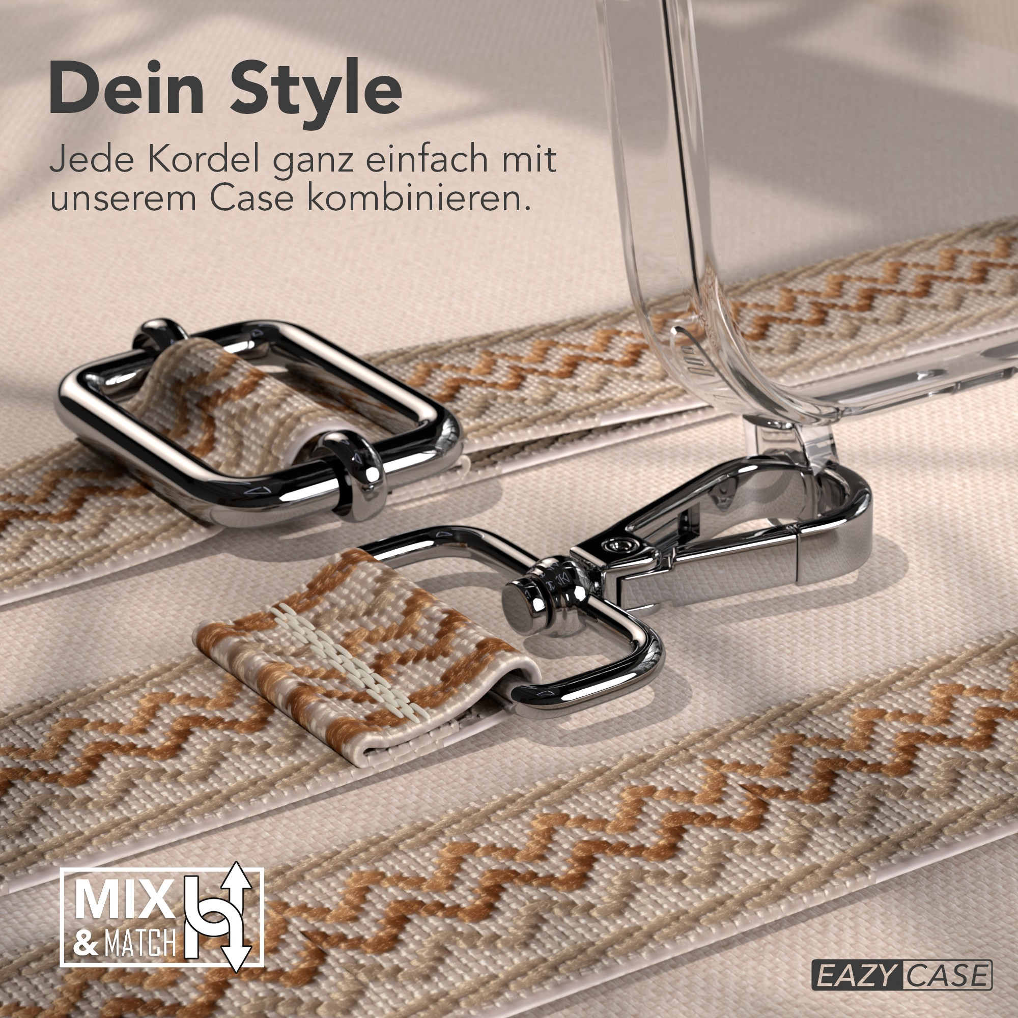 Nahaufnahme eines Handyhüllenriemens mit Metallverschluss. Beige gemusterter Riemen, transparente Hülle, Text: Mix & Match.