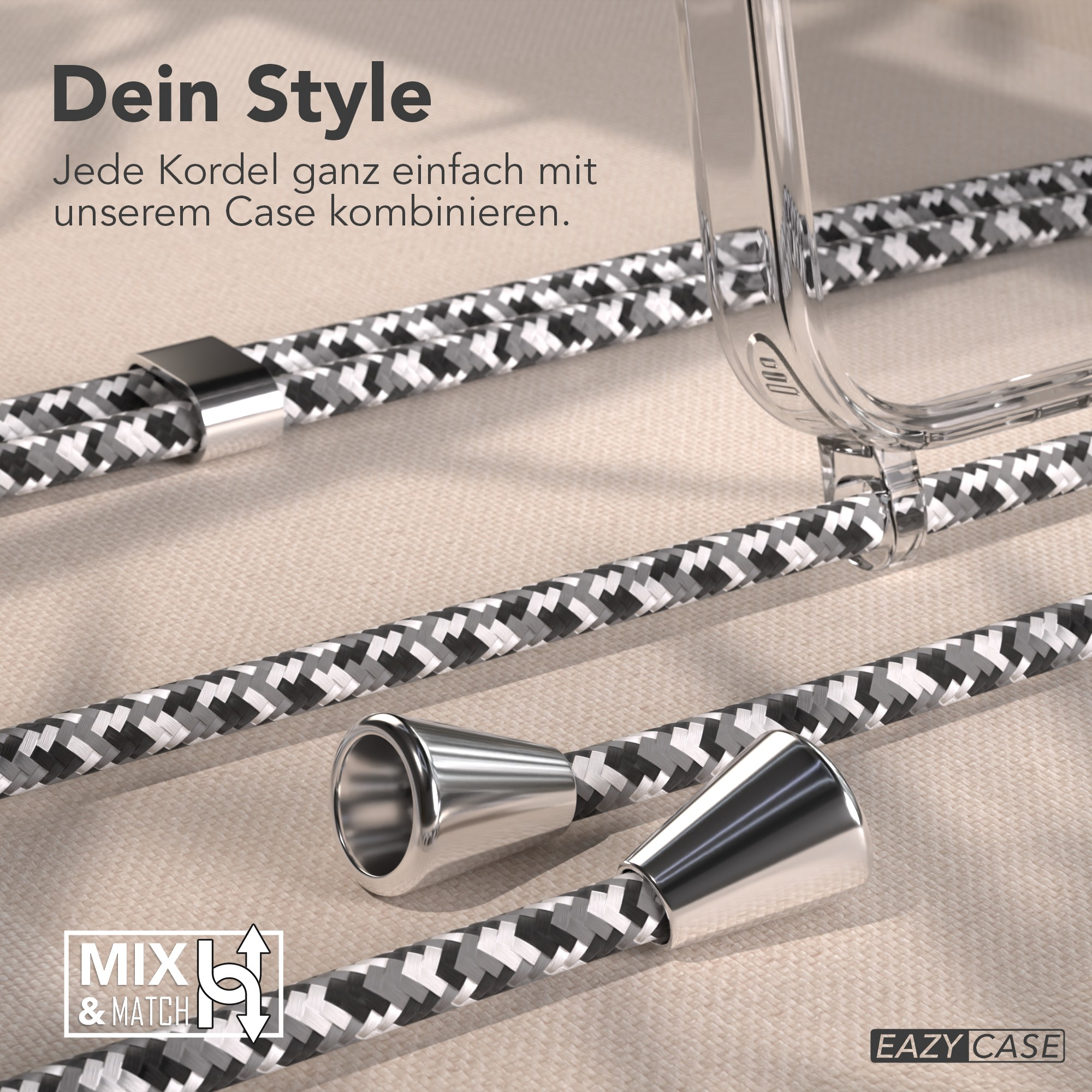 Eine transparente Handyhülle und gemusterte Kordeln. Die Kordeln sind grau, weiß und schwarz. Silberne Metallakzente. Text auf Deutsch.