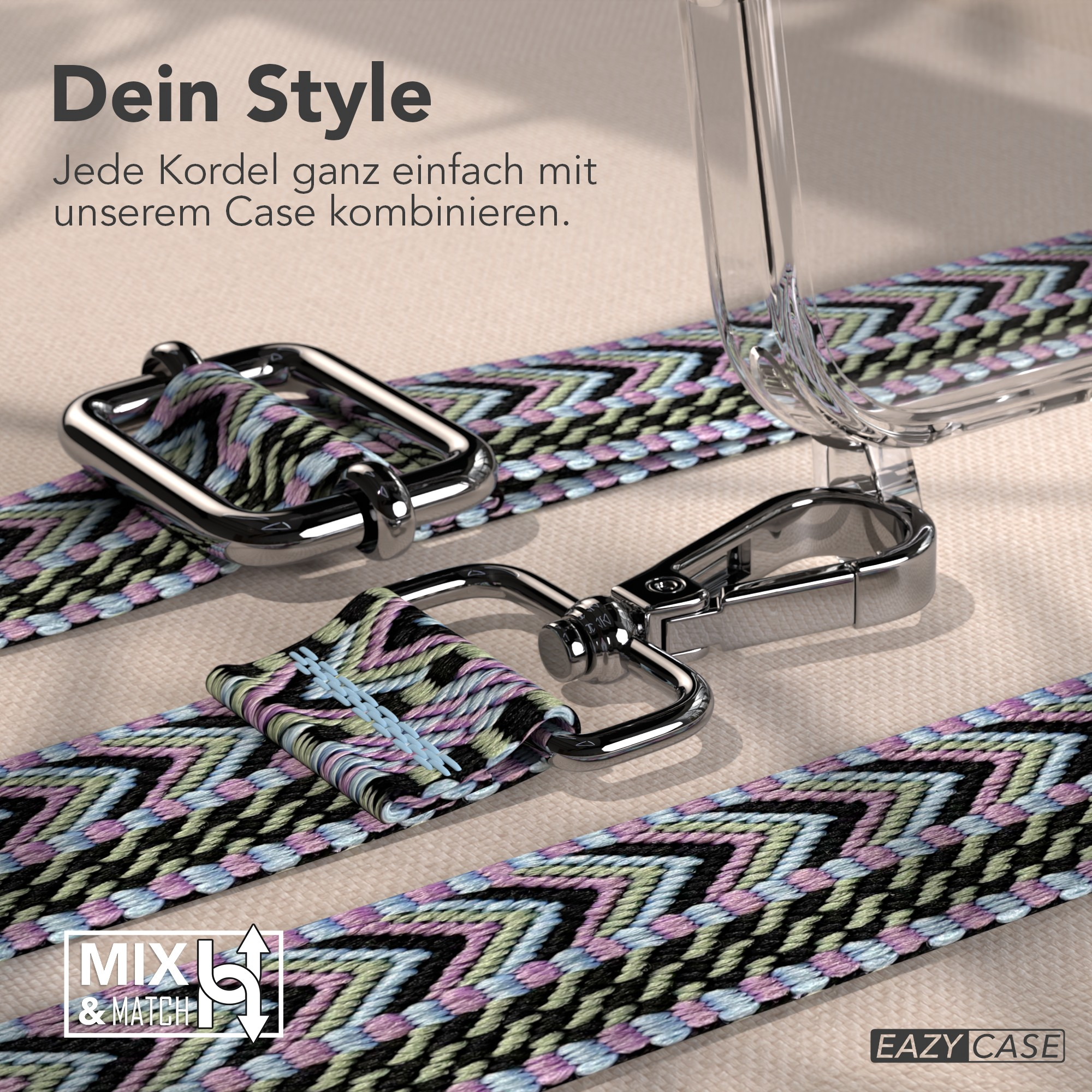 Nahaufnahme eines Handyhüllenriemens mit farbenfrohem Muster. Metallschnallen und eine transparente Handyhülle sind sichtbar. Der Hintergrund ist beige.