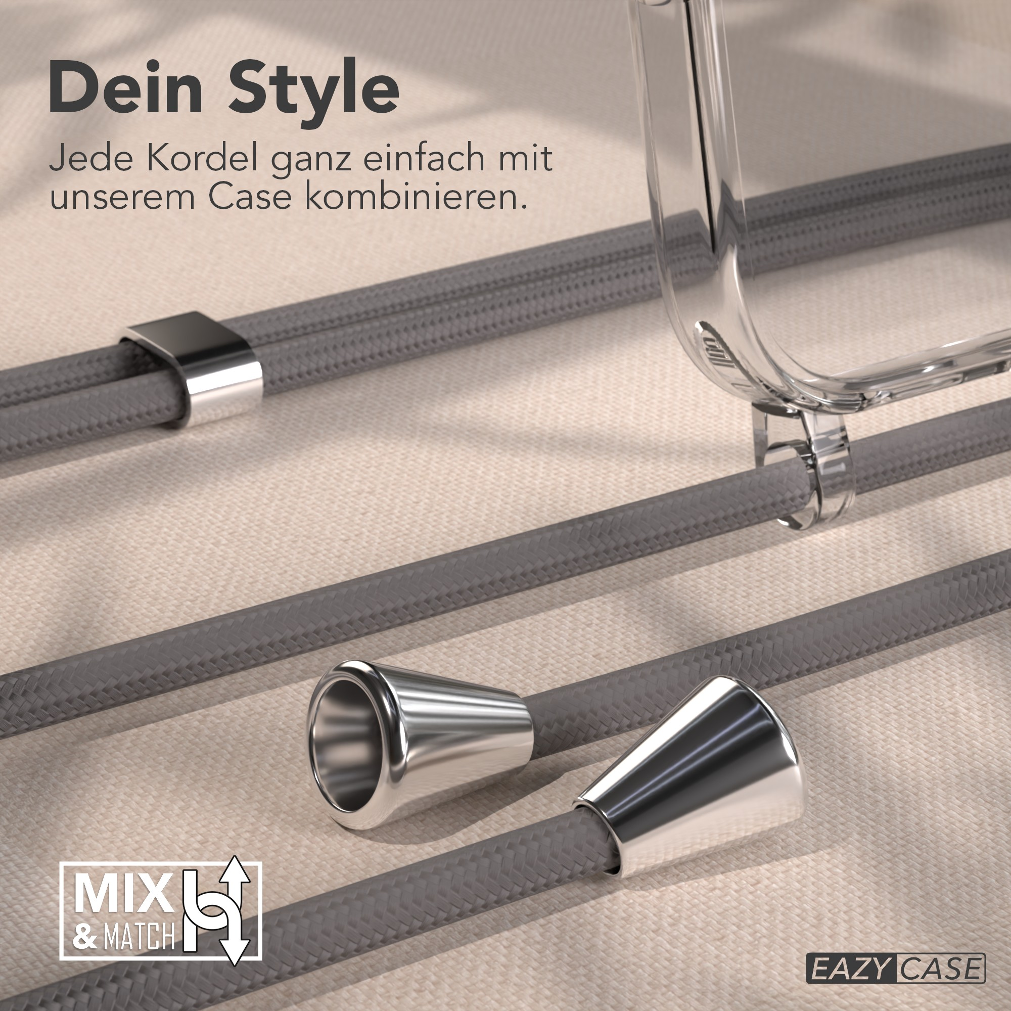 Das Bild zeigt graue Kordeln mit Metalldetails und eine transparente Handyhülle, mit dem Text 'Dein Style'.