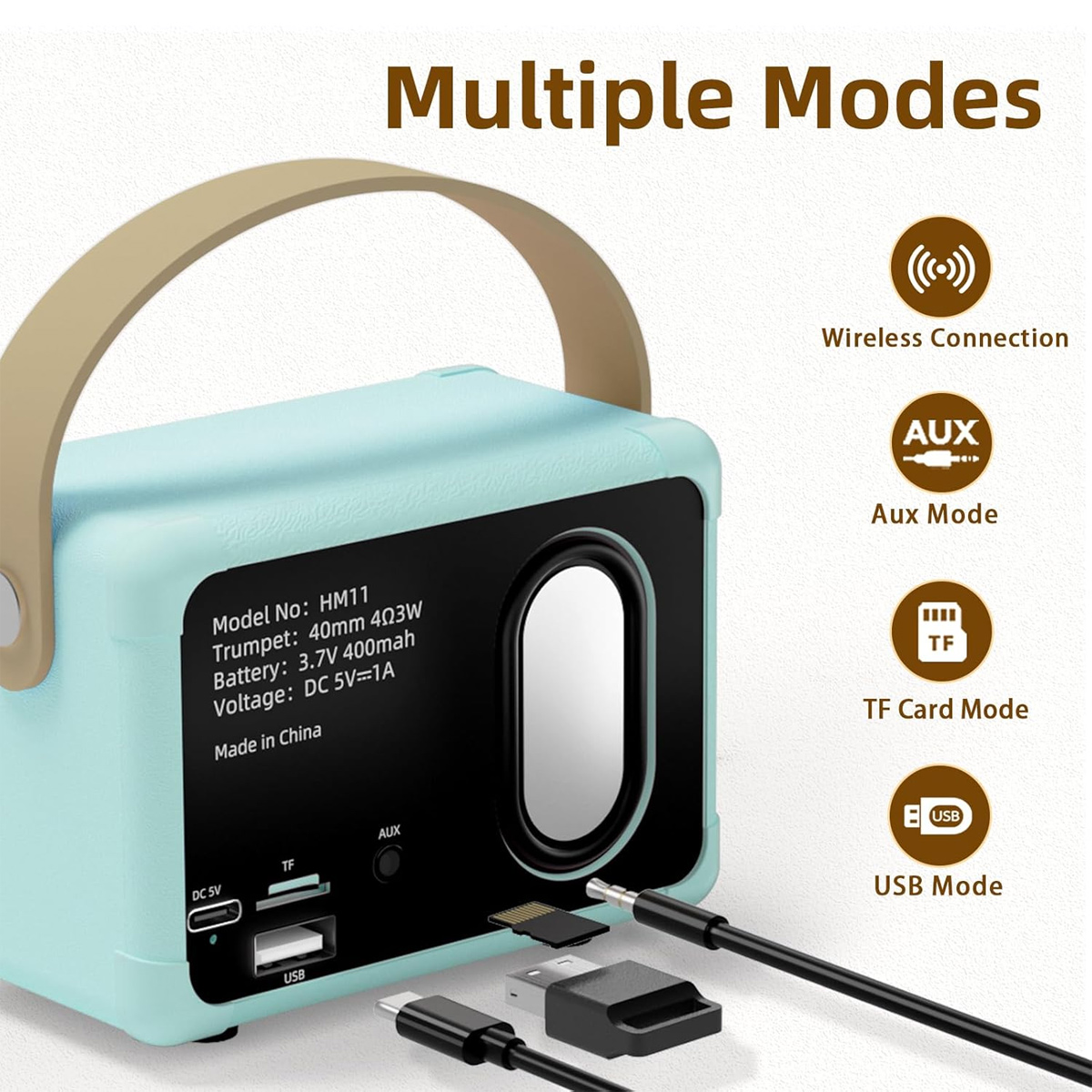Ein türkisfarbener Lautsprecher mit braunem Griff. Er hat mehrere Modi: Wireless, AUX, TF-Karte und USB. Kabel und Anschlüsse sind sichtbar.