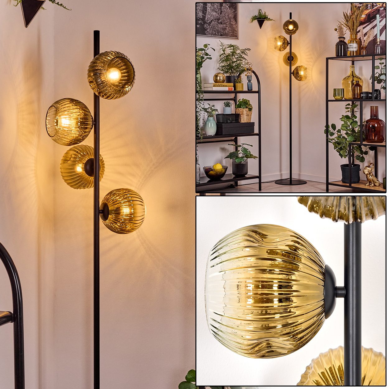 Eine Stehlampe mit vier goldenen Glaskugeln. Sie steht vor einer weißen Wand mit einem schwarzen Regal im Hintergrund.