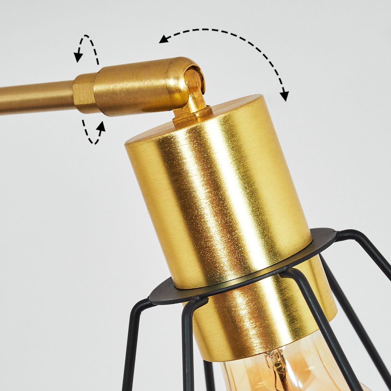 Nahaufnahme einer goldenen Lampe mit schwarzem Käfig und Pfeilen, die die Bewegung anzeigen. Die Lampe befindet sich vor einem weißen Hintergrund.